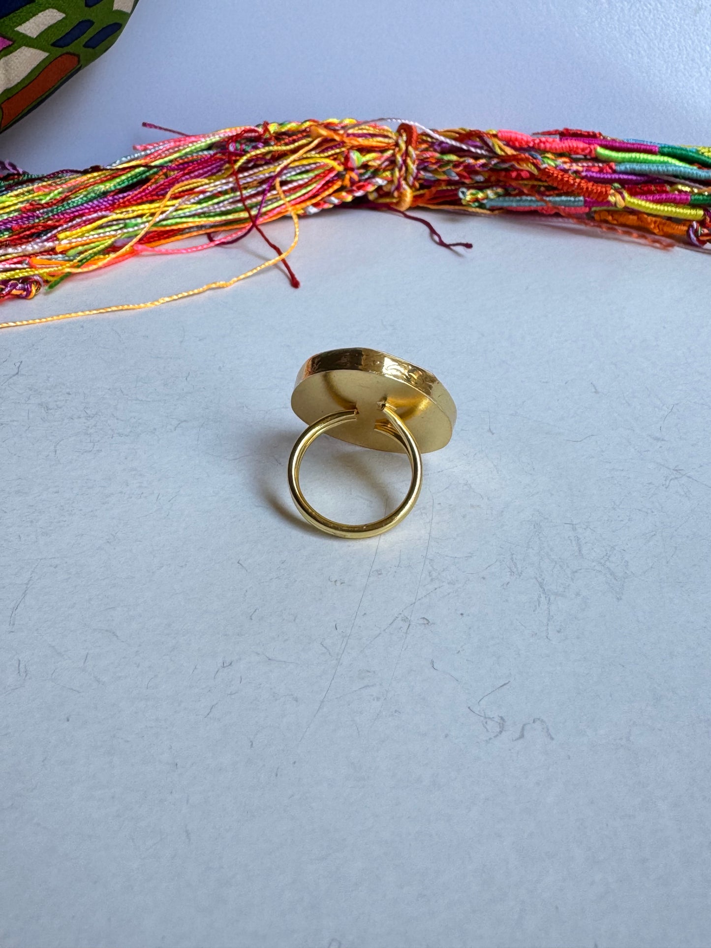 Golden ring drop green bottle