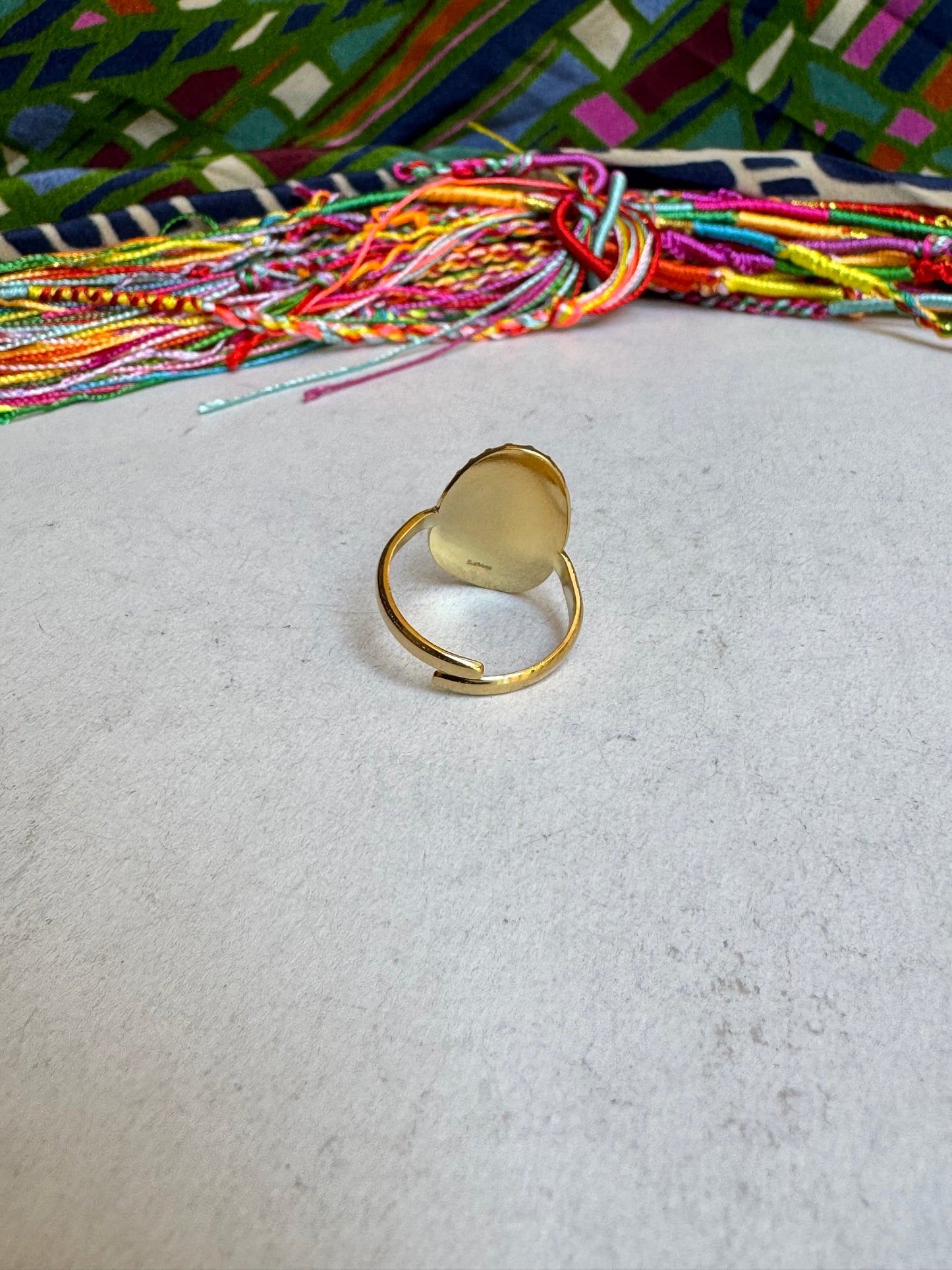 Hammered oval golden steel ring