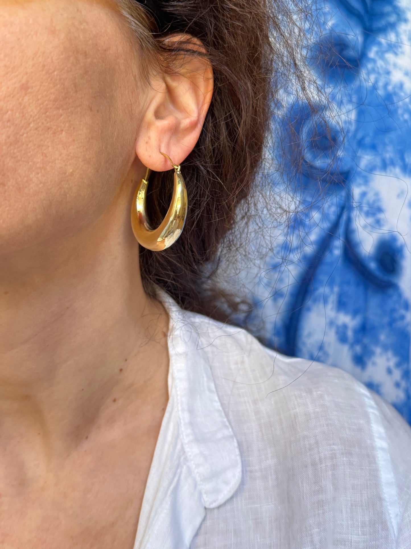 Large rounded golden boho earrings