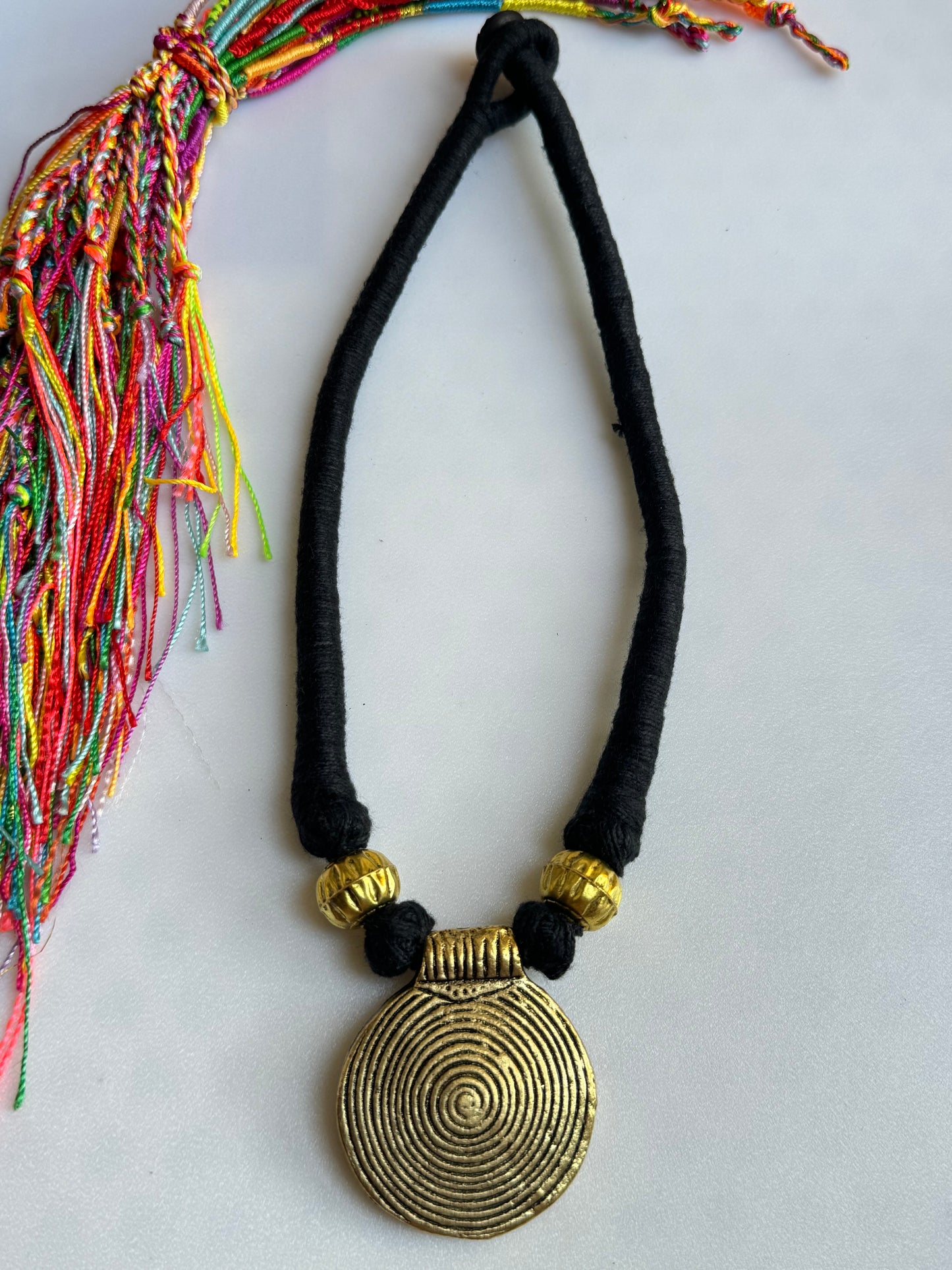 Black necklace gold medallion