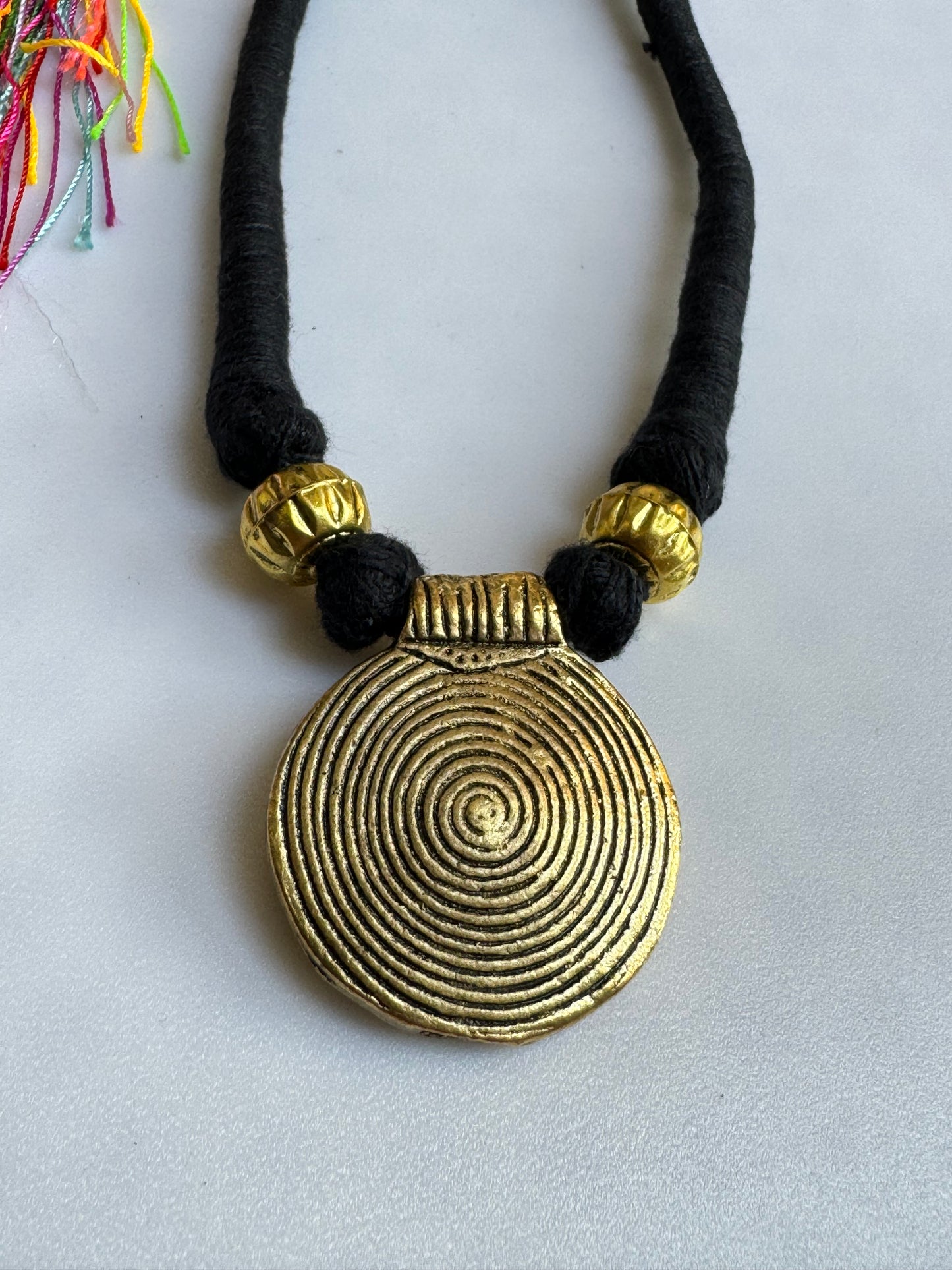 Black necklace gold medallion