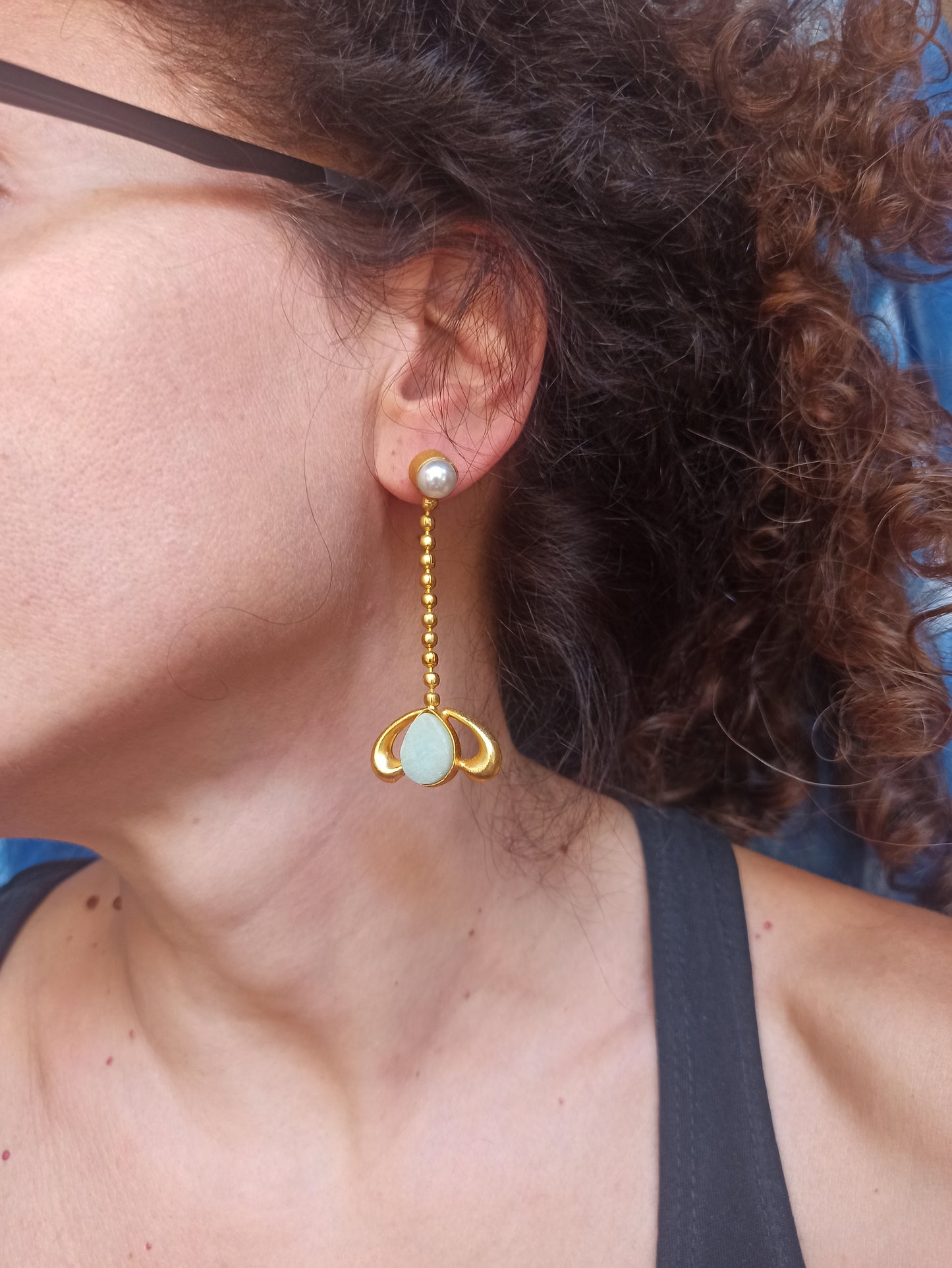 Golden earrings with aqua green stone