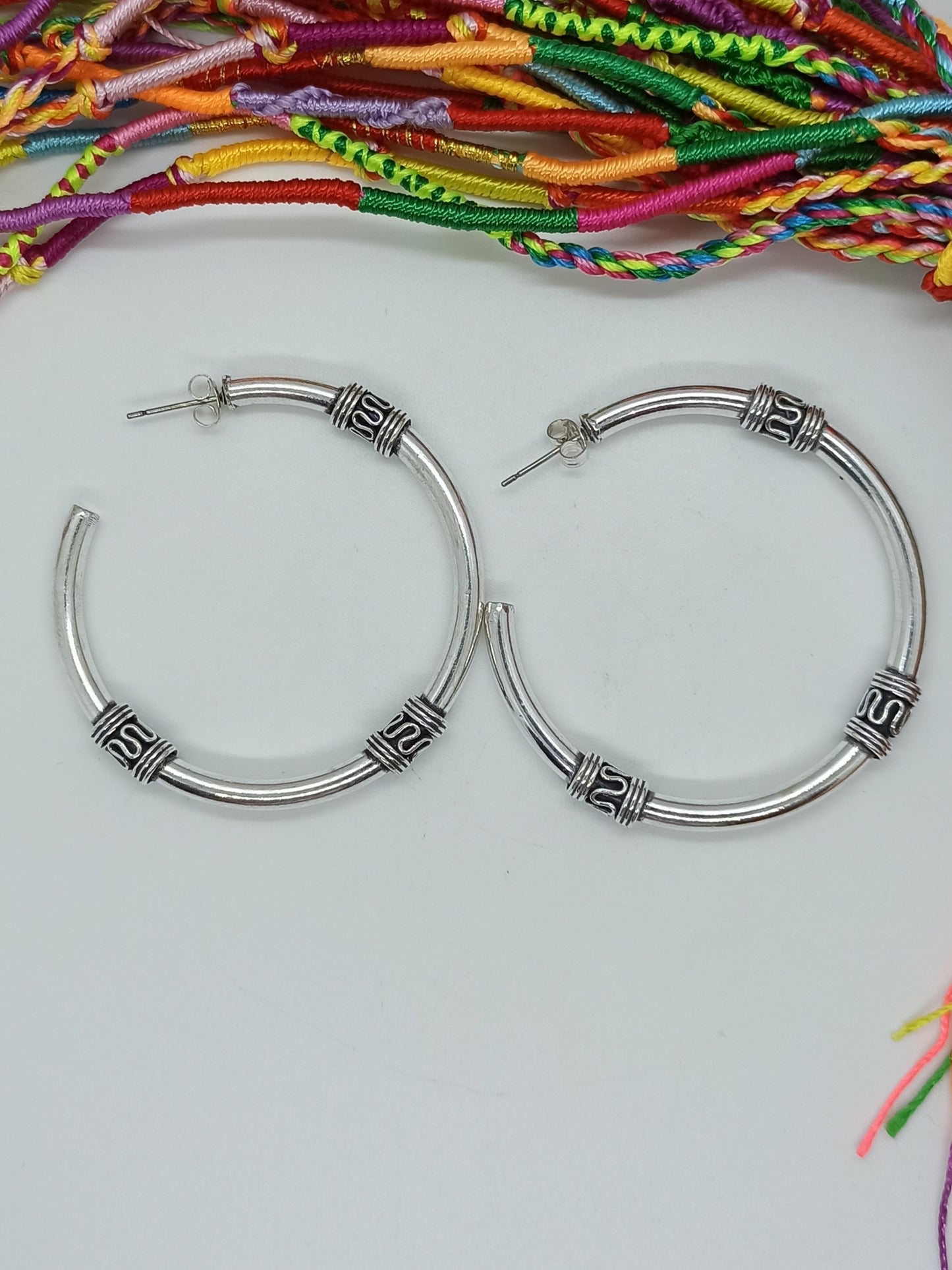 Silver boho earrings with large tribal circles and butterfly