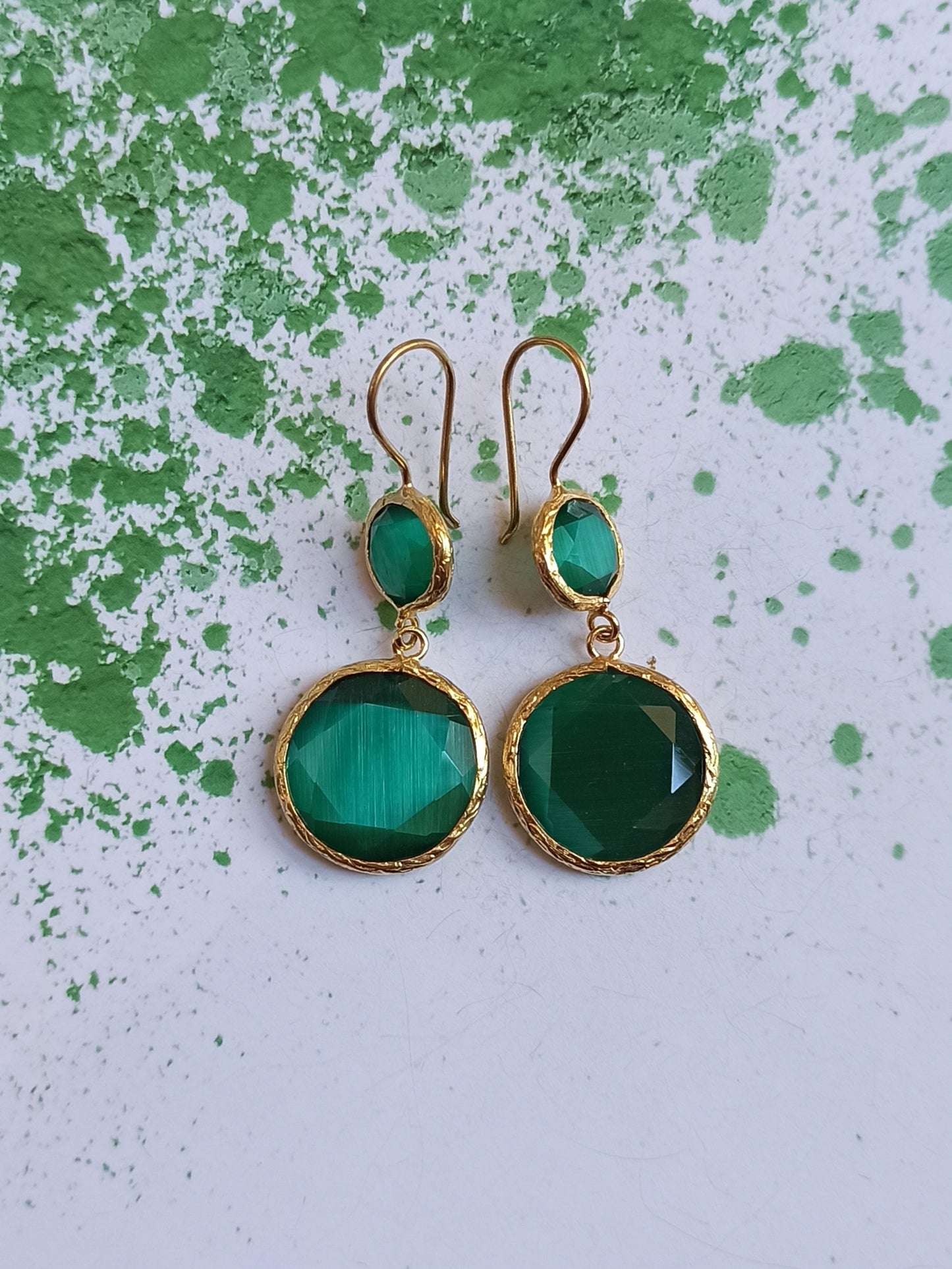 Earrings with 2 bottle green stones