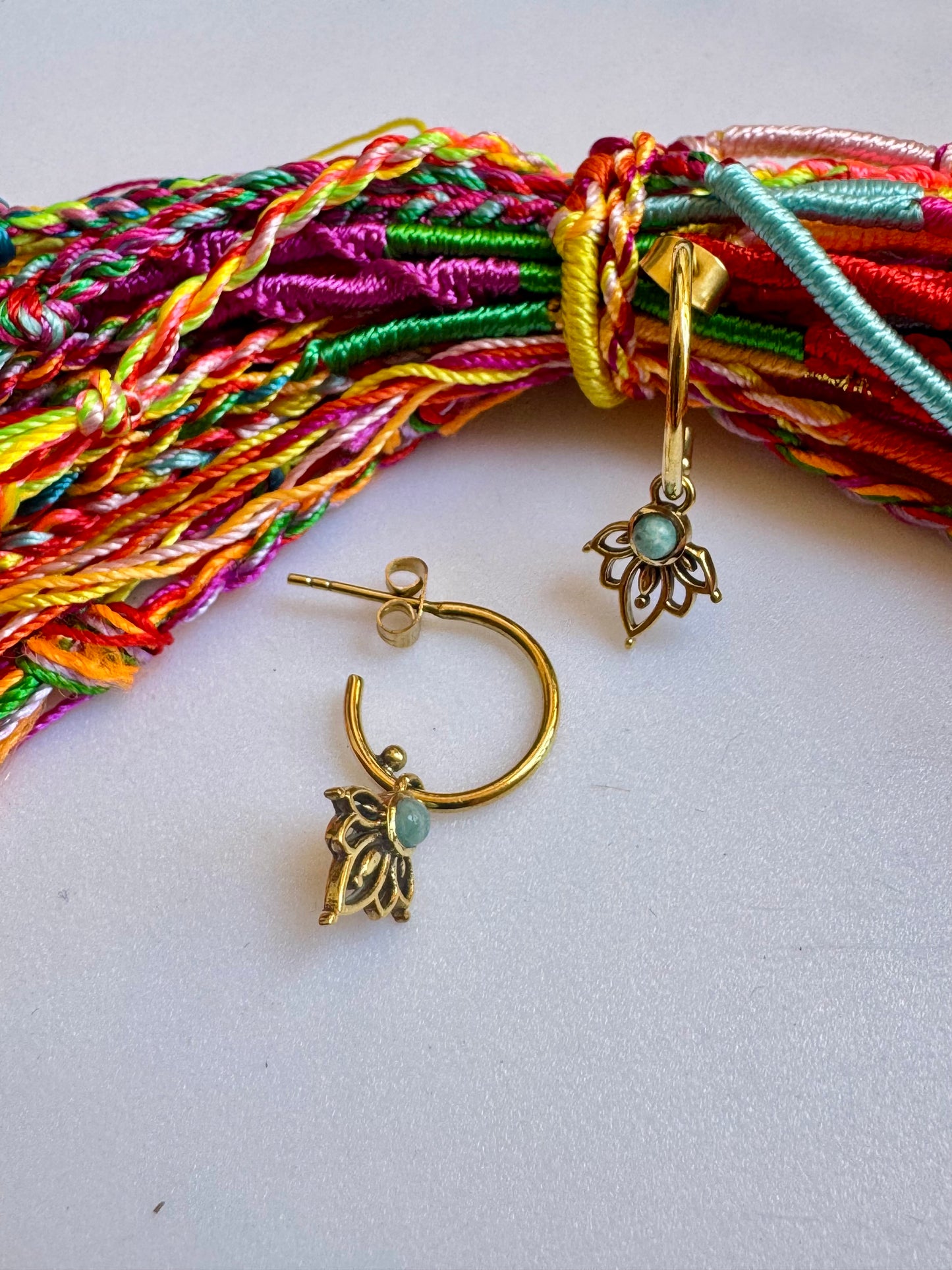 Golden boho earrings with a light blue hoop