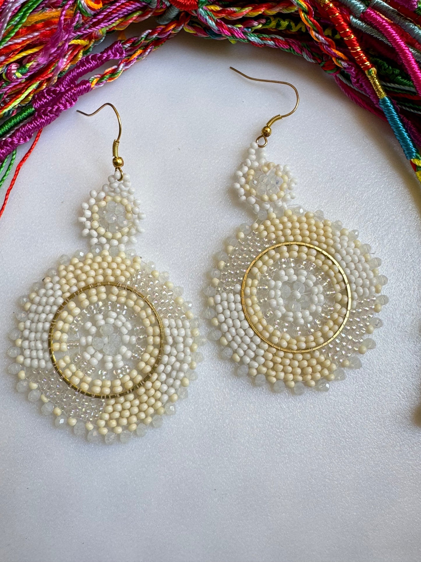 Golden earrings white beads