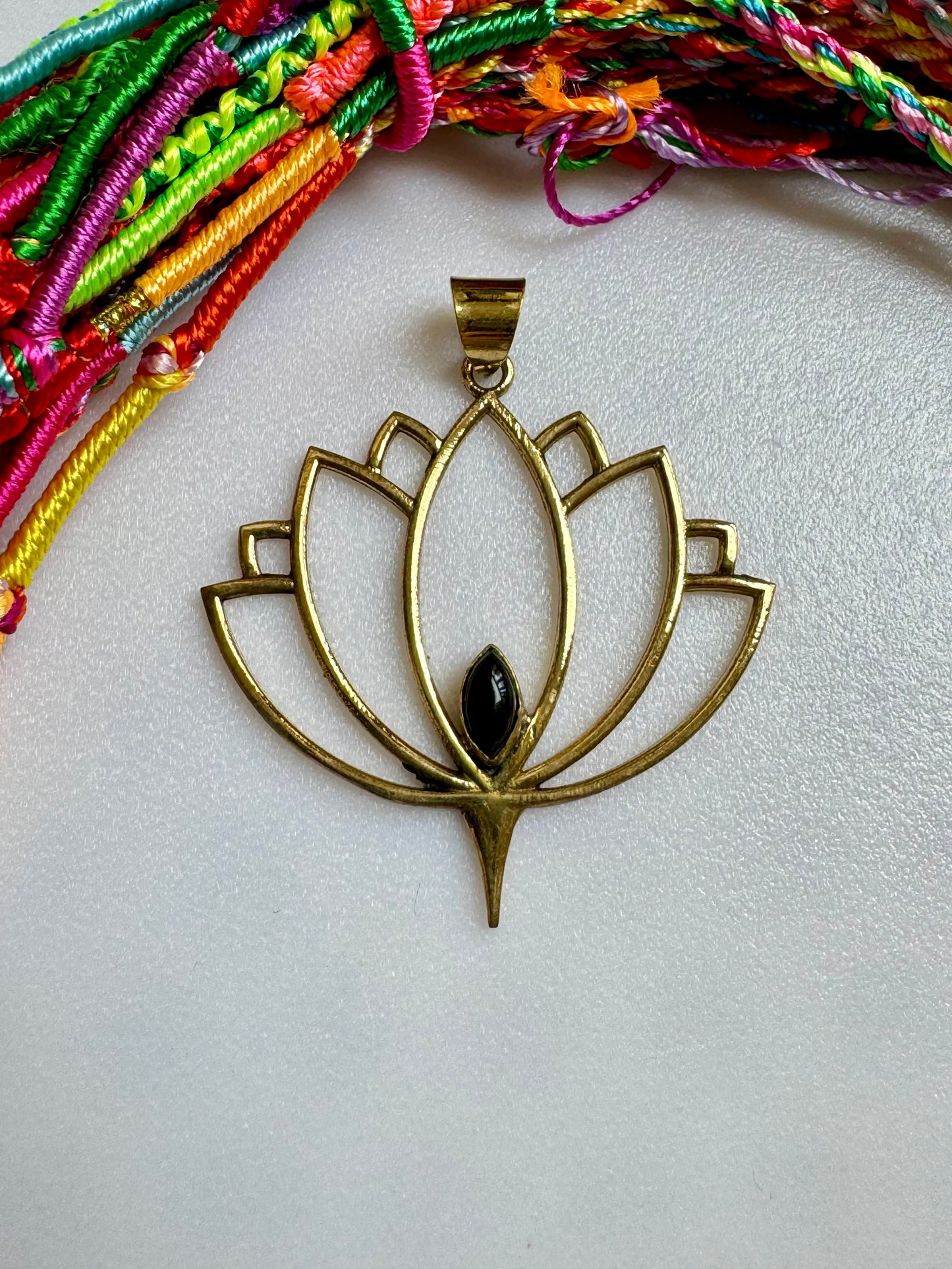 Golden necklace with black onyx lotus flower pendant