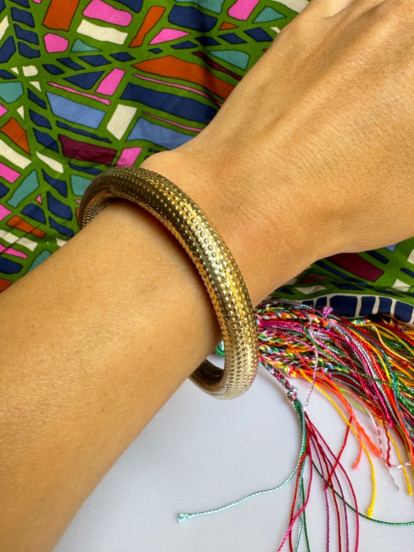 Domed golden bangle bracelet