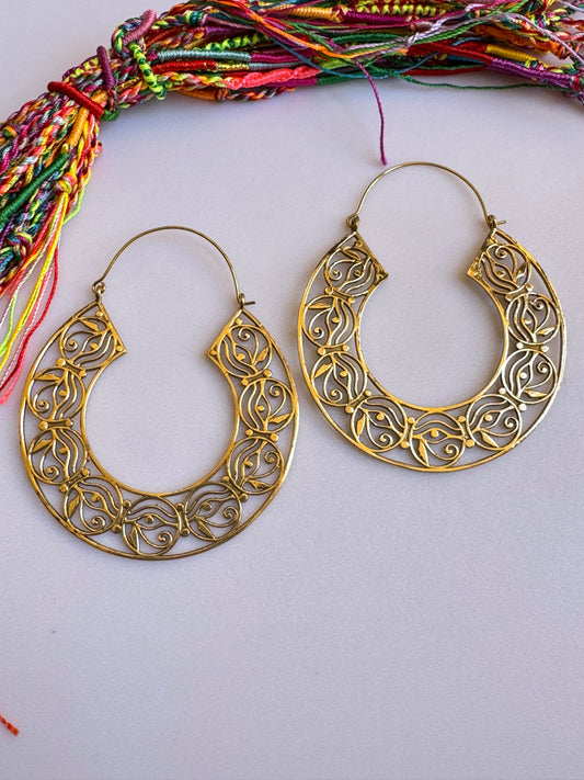 Orecchini boho dorati cerchi occhio di Horo