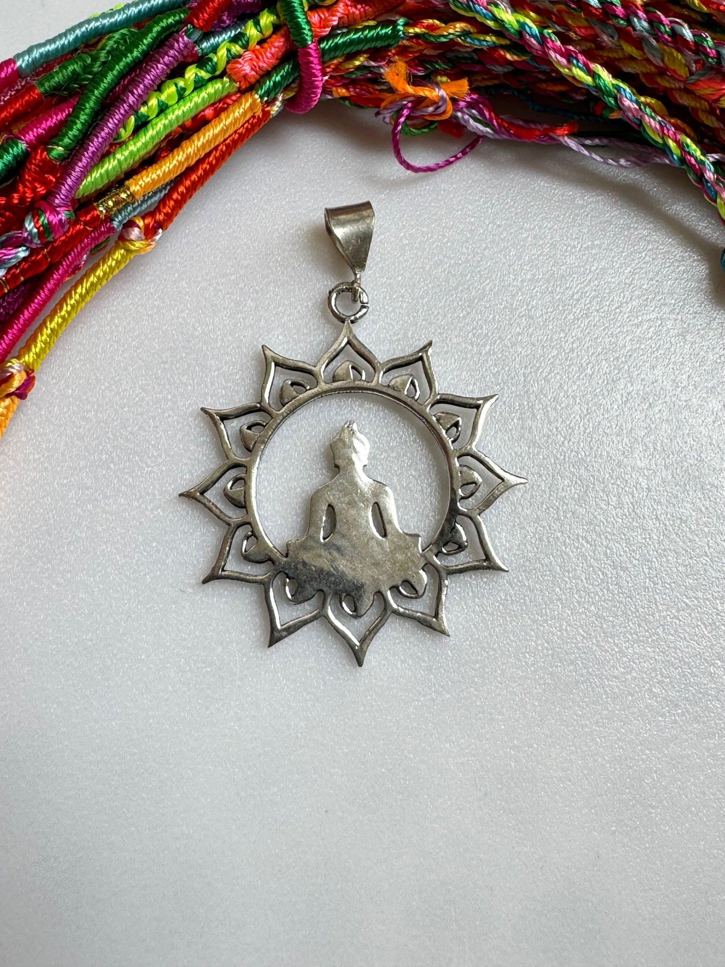 Silver necklace with buddha in the sun pendant