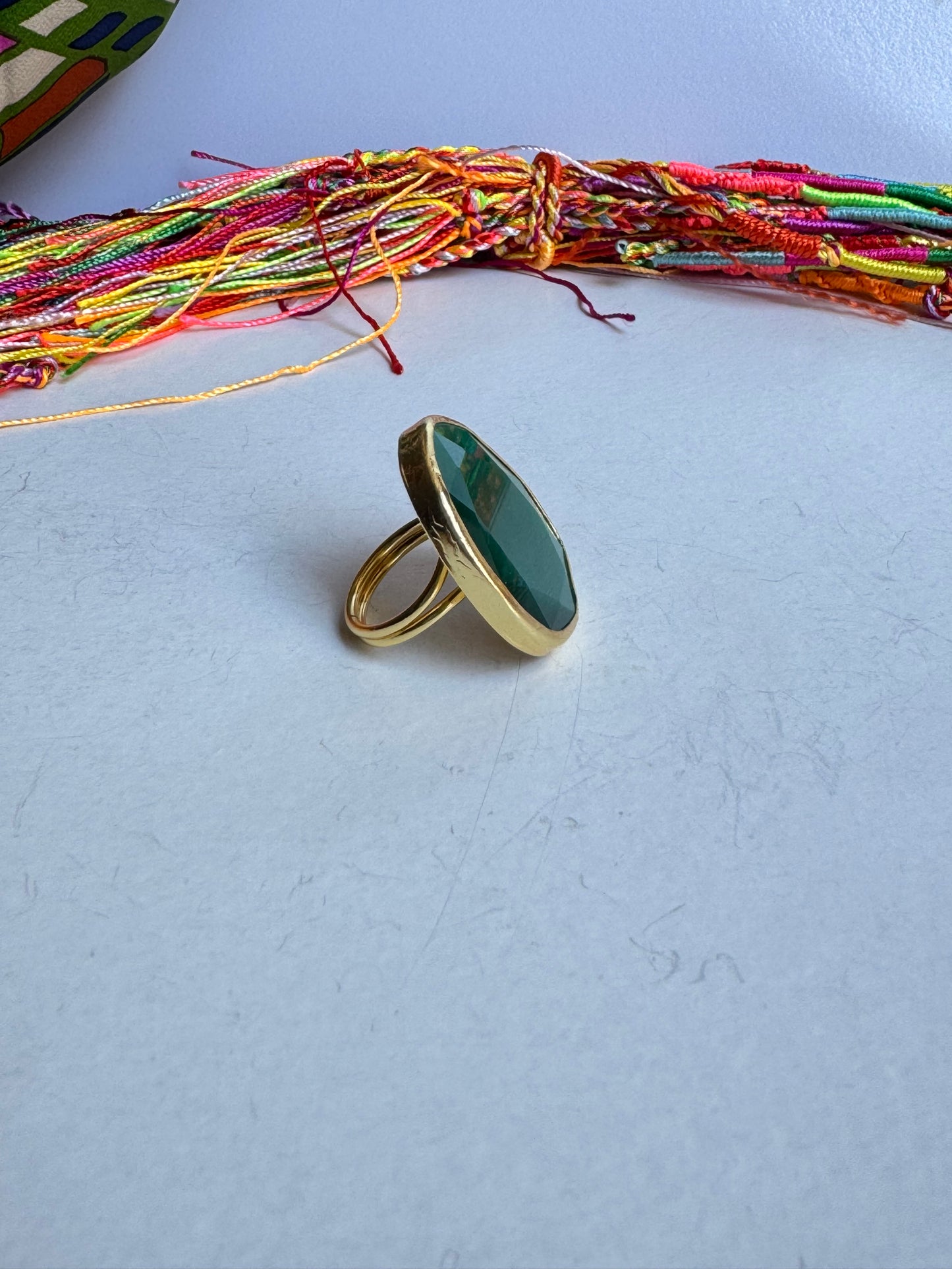 Golden ring drop green bottle