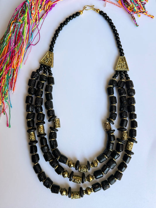 Multi-strand necklace with black compasses