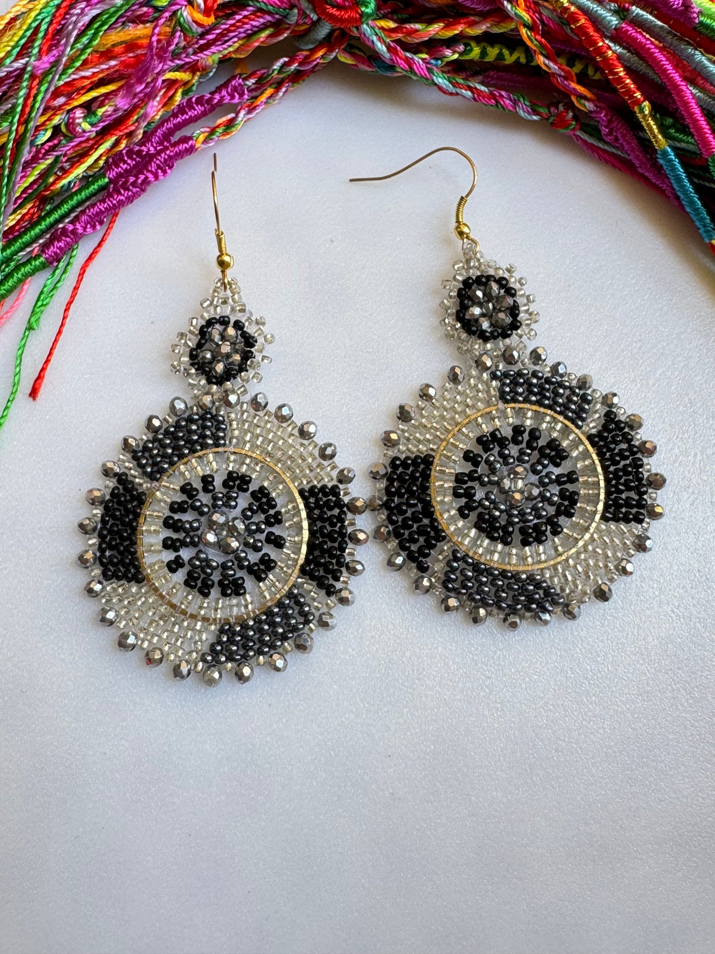 Golden earrings black beads