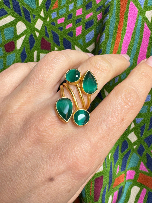 Golden ring with 4 green stones