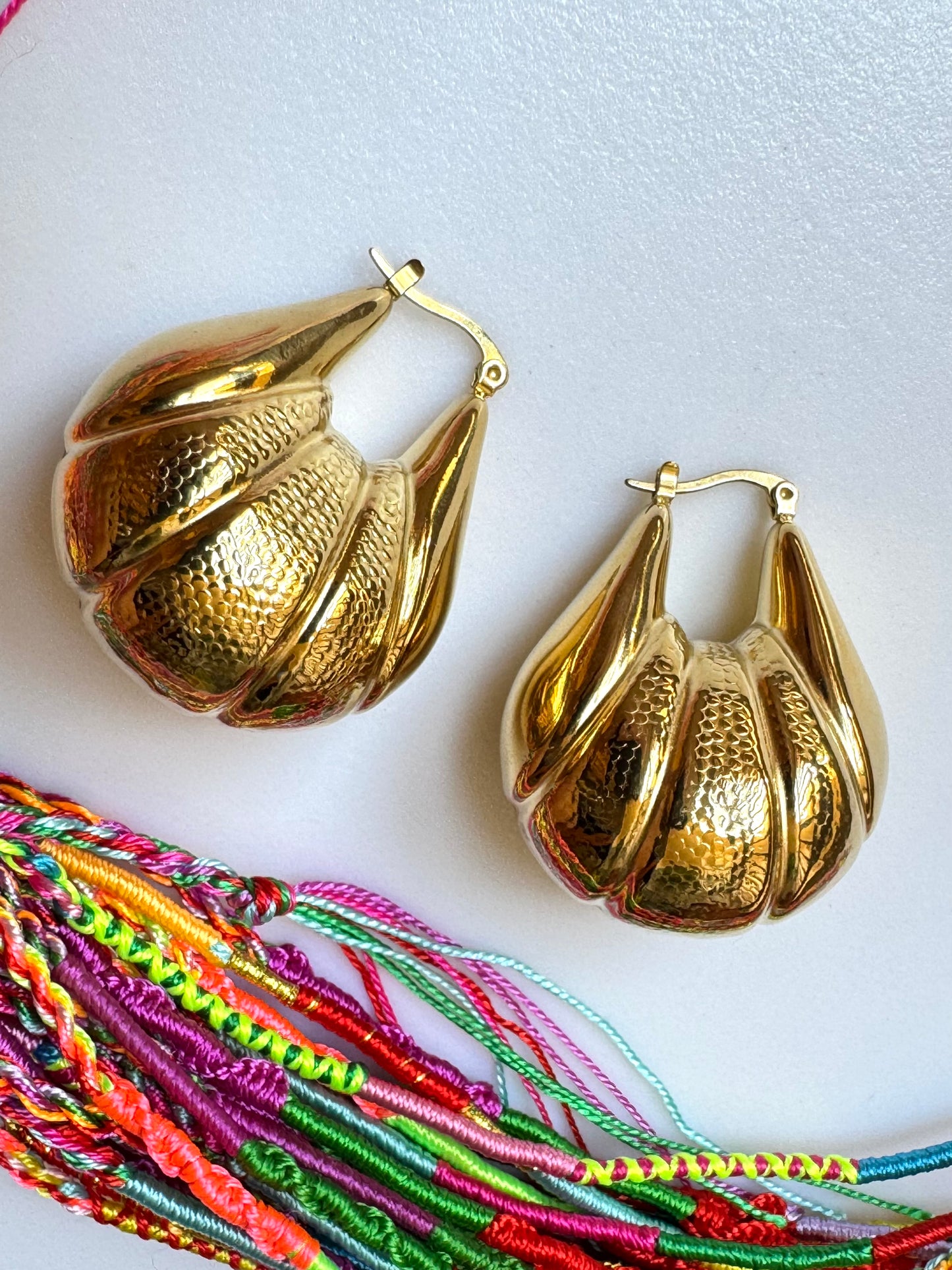 Domed gold steel earrings