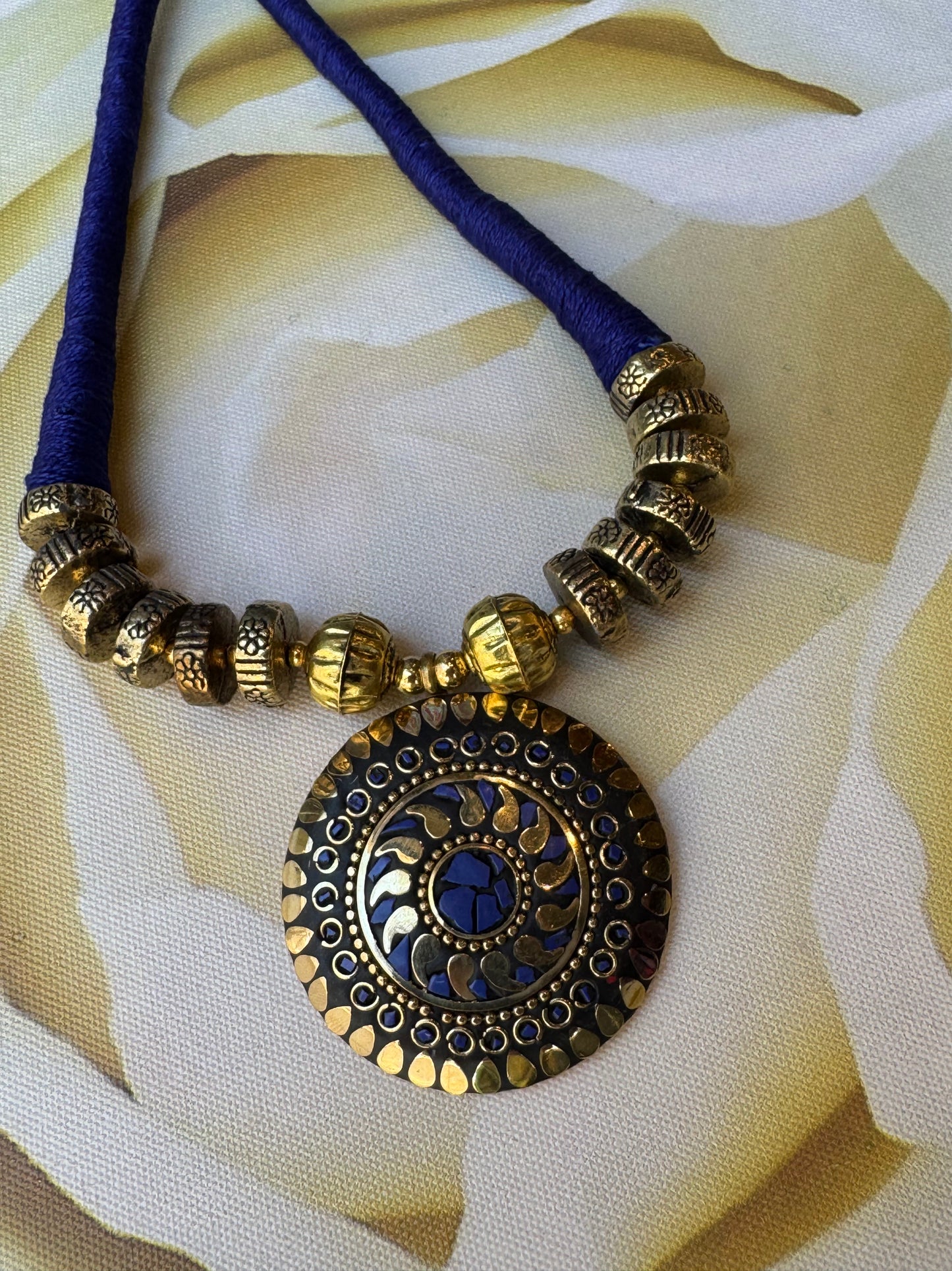 Long Nepalese necklace with blue medallion