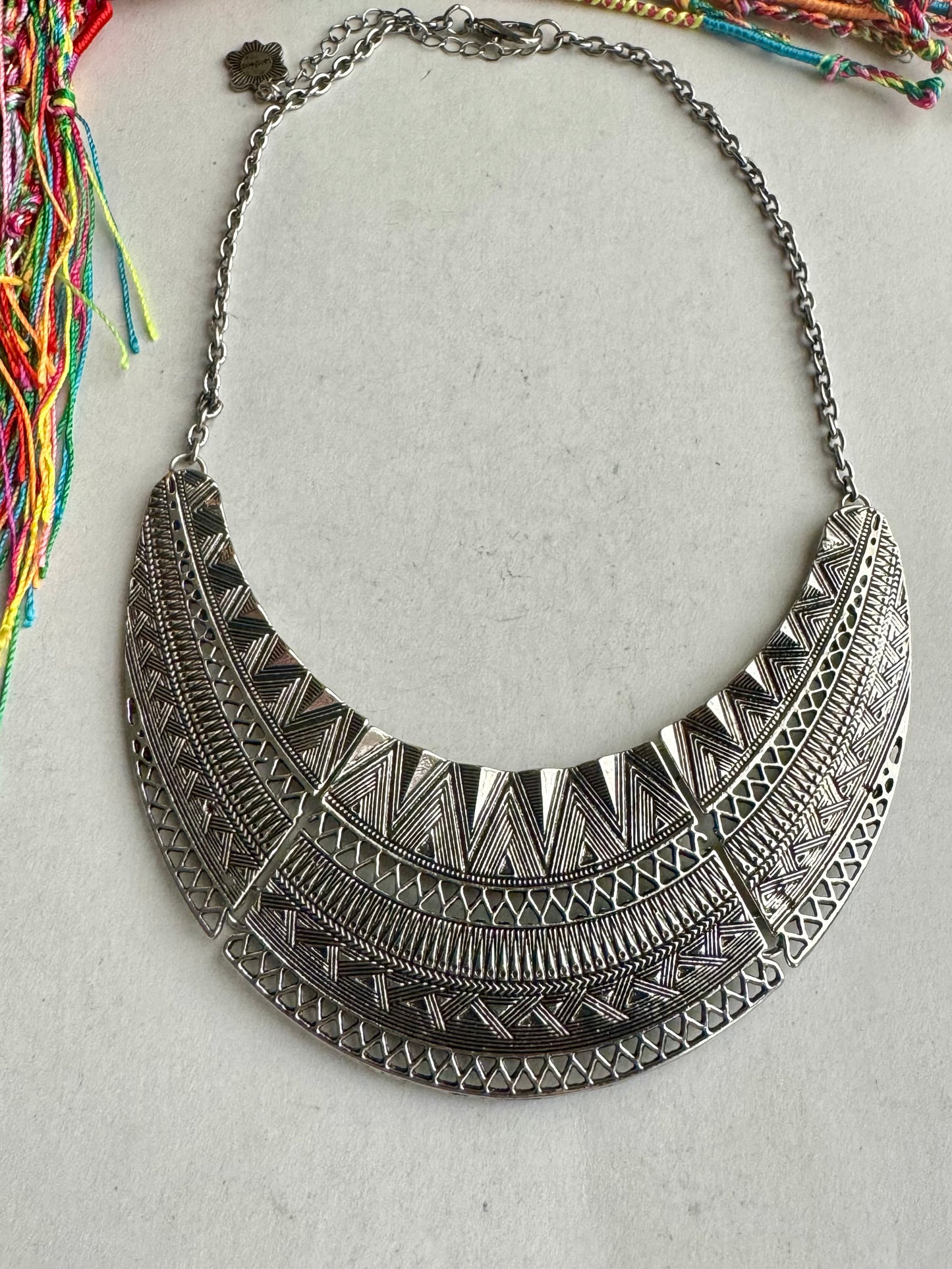 Engraved silver bib necklace