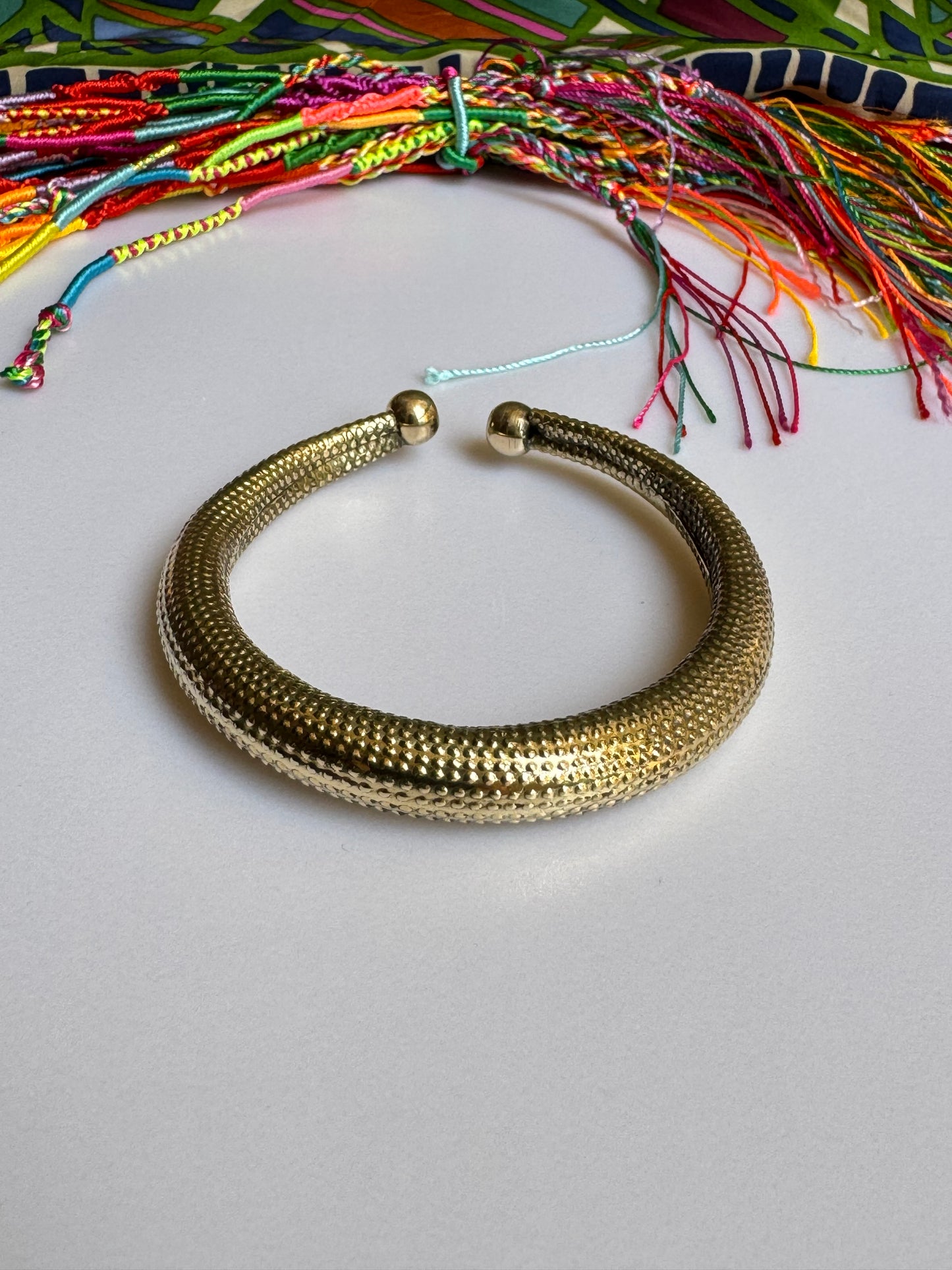 Domed golden bangle bracelet