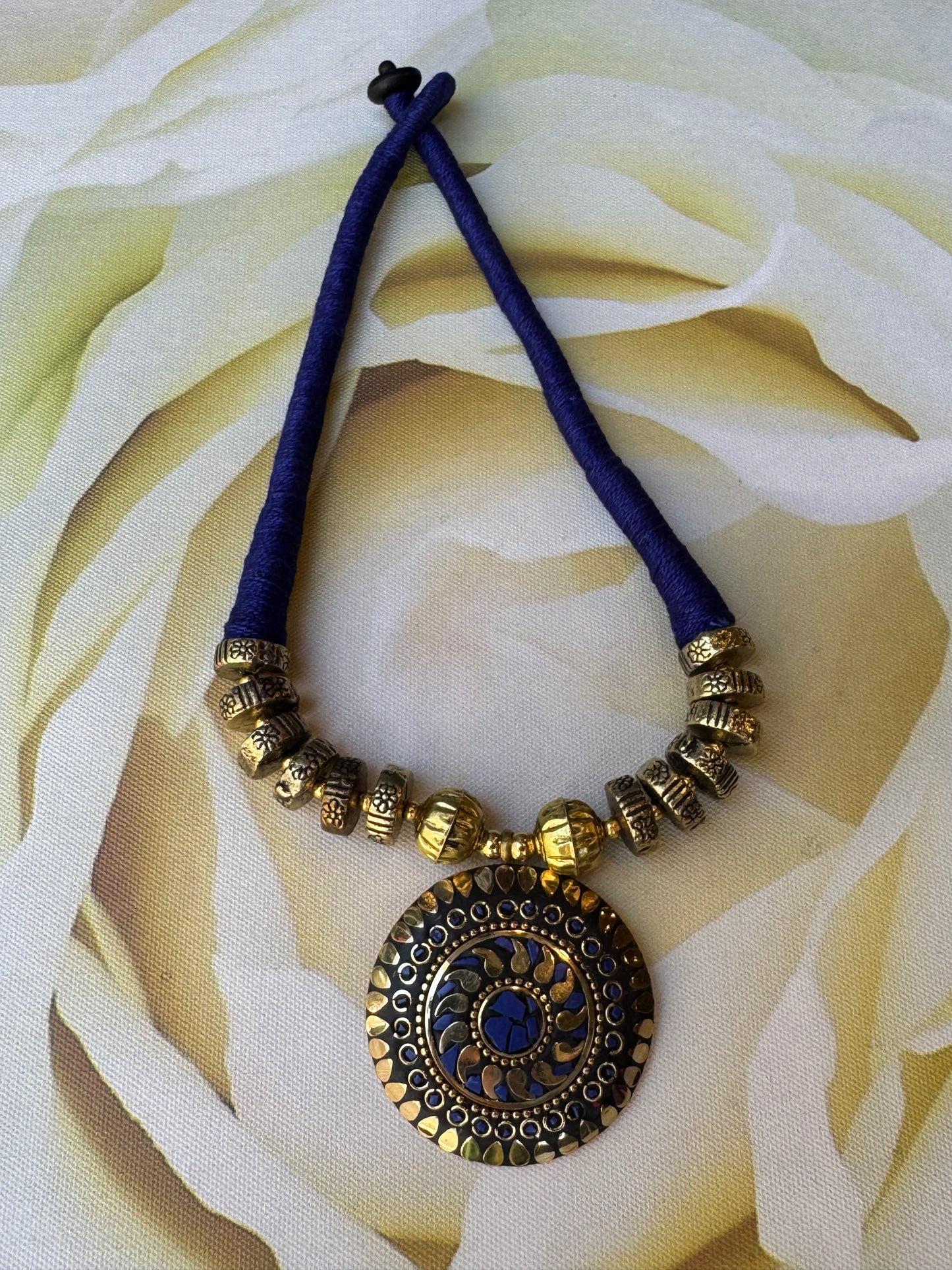 Long Nepalese necklace with blue medallion