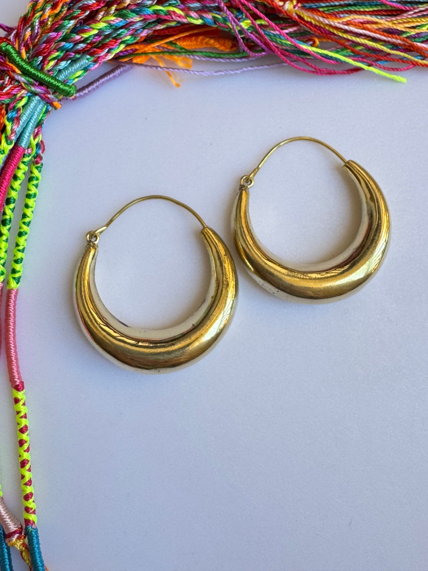 Large rounded golden boho earrings