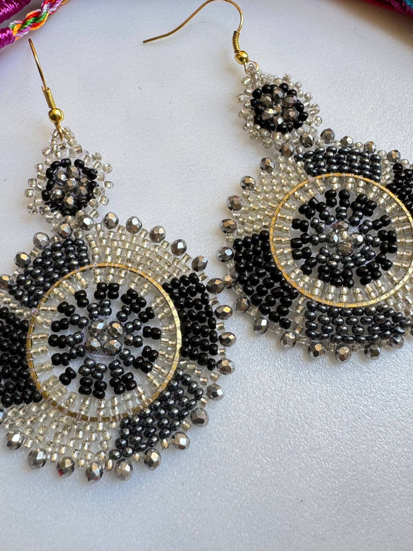 Golden earrings black beads