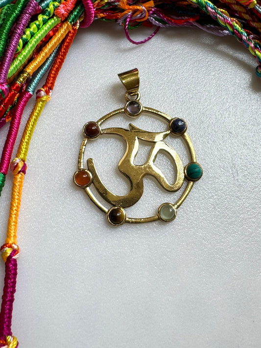 Golden necklace with seven chakra ohm pendant