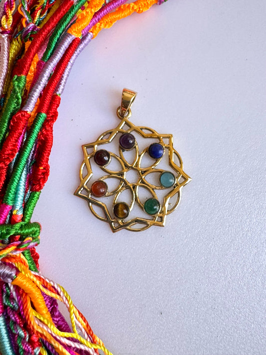 Golden necklace with seven chakra flower of life pendant
