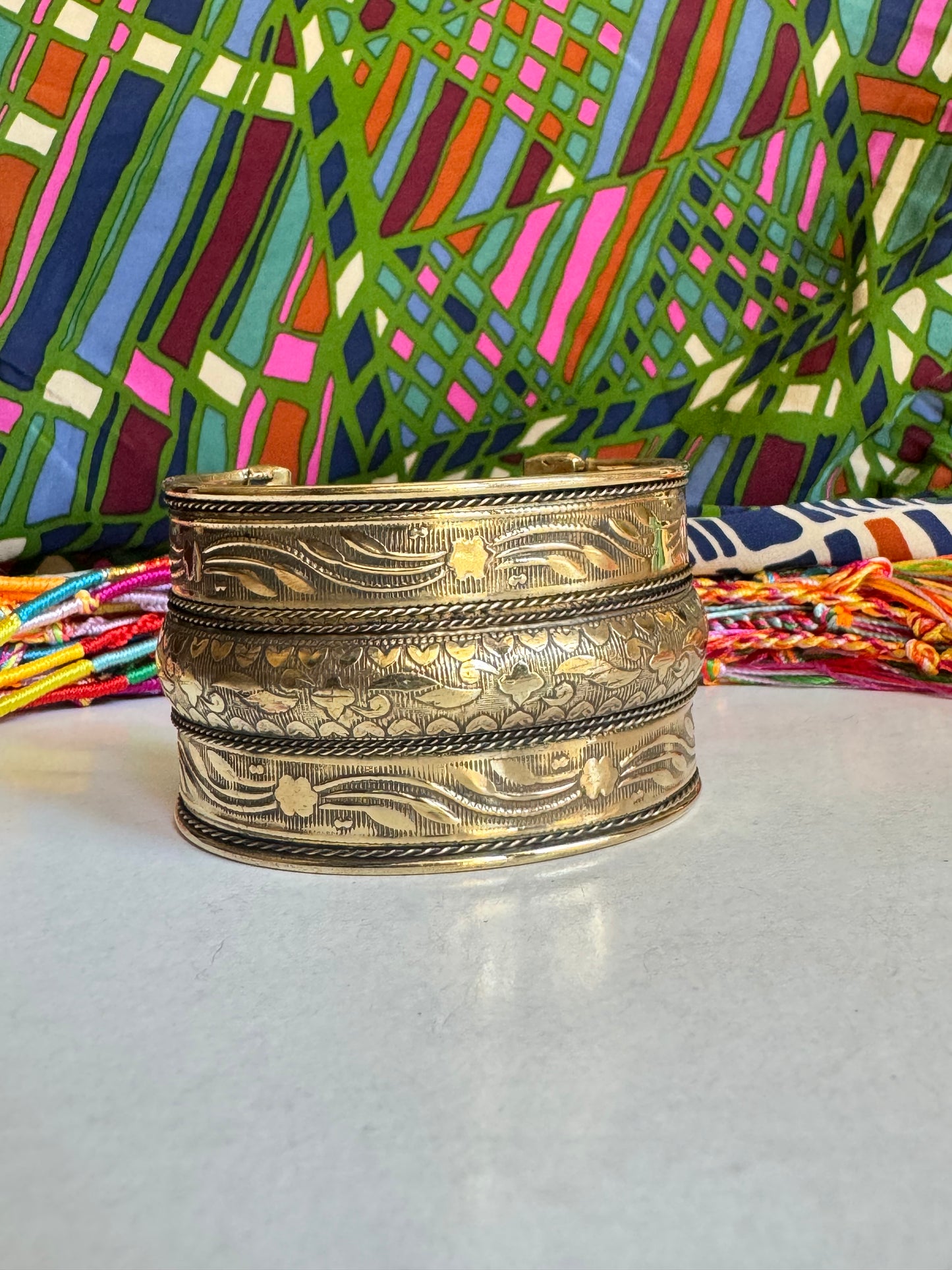 Golden bangle bracelet with flowers and hearts