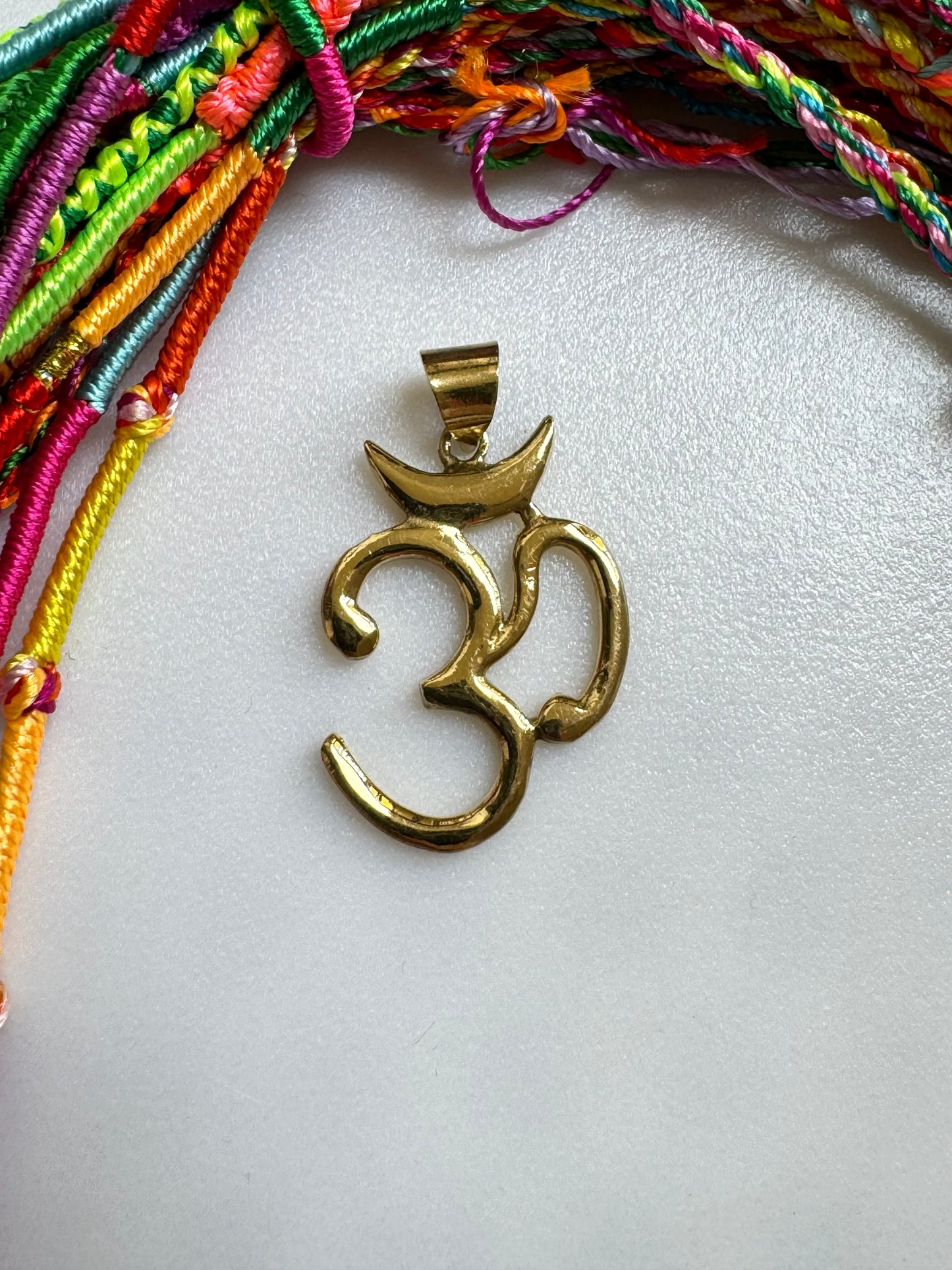 Golden necklace with ohm pendant