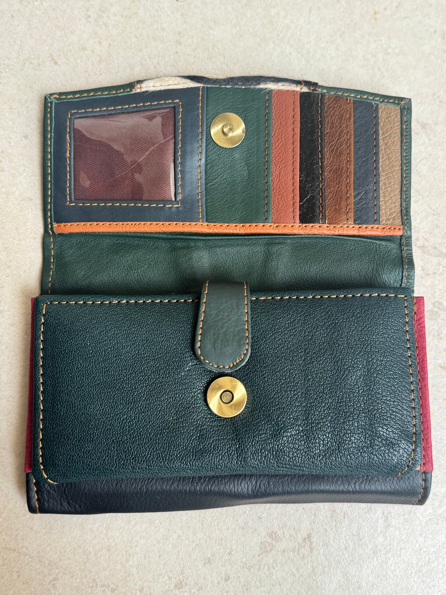 Green and blue spotted leather wallet