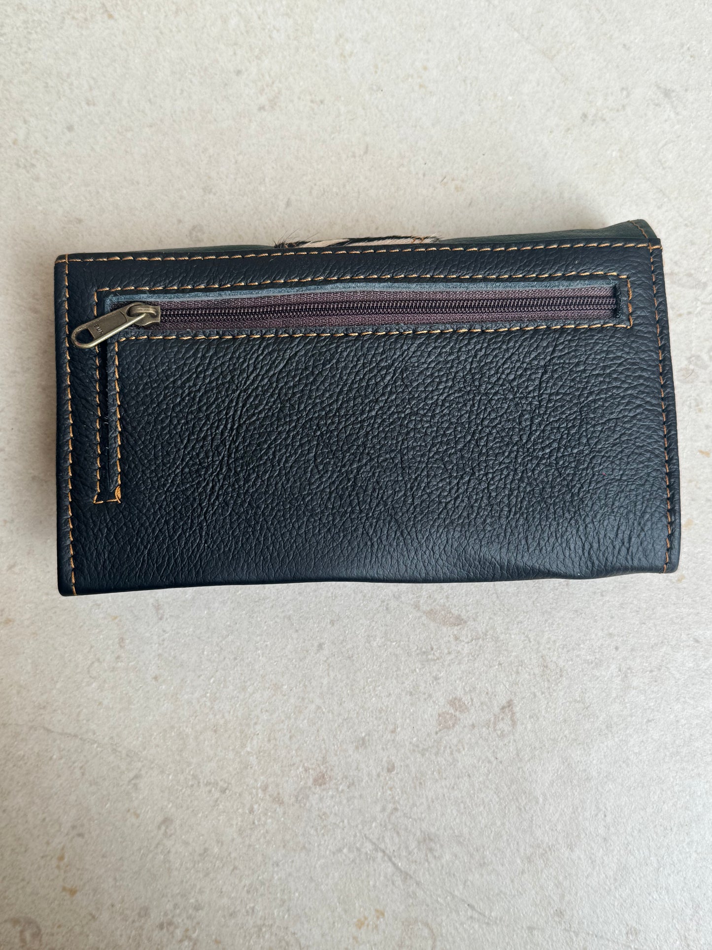 Green and blue spotted leather wallet