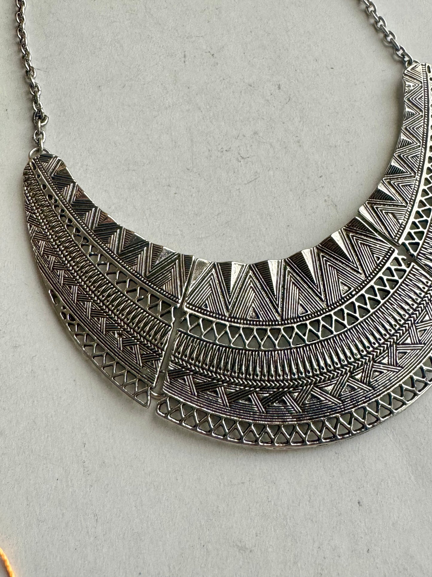 Engraved silver bib necklace