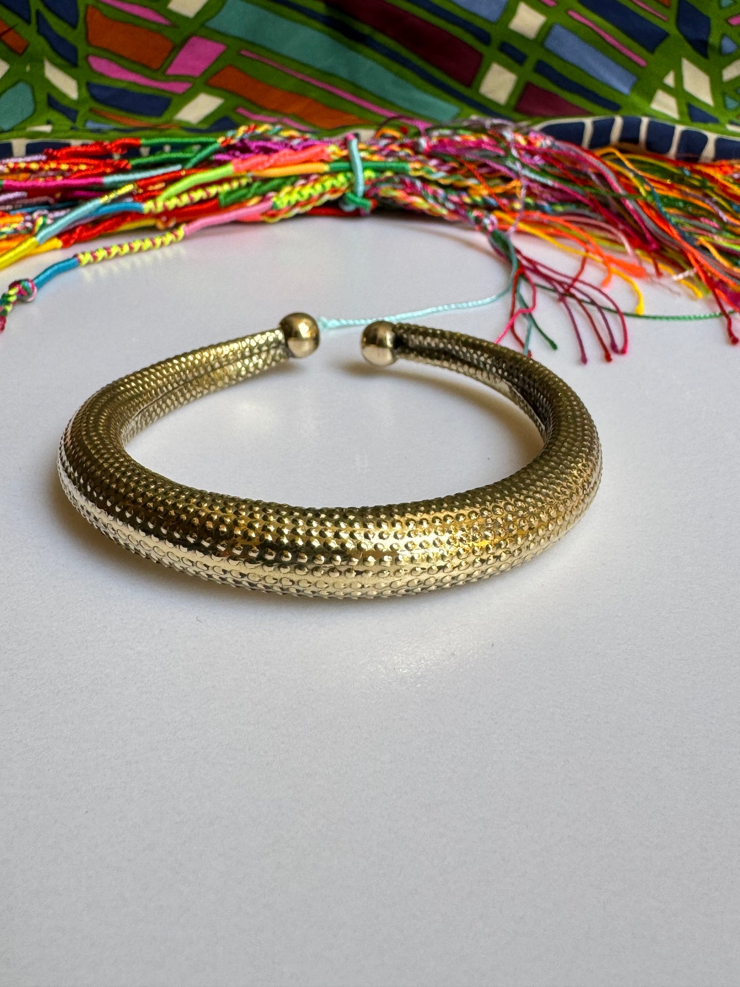 Domed golden bangle bracelet