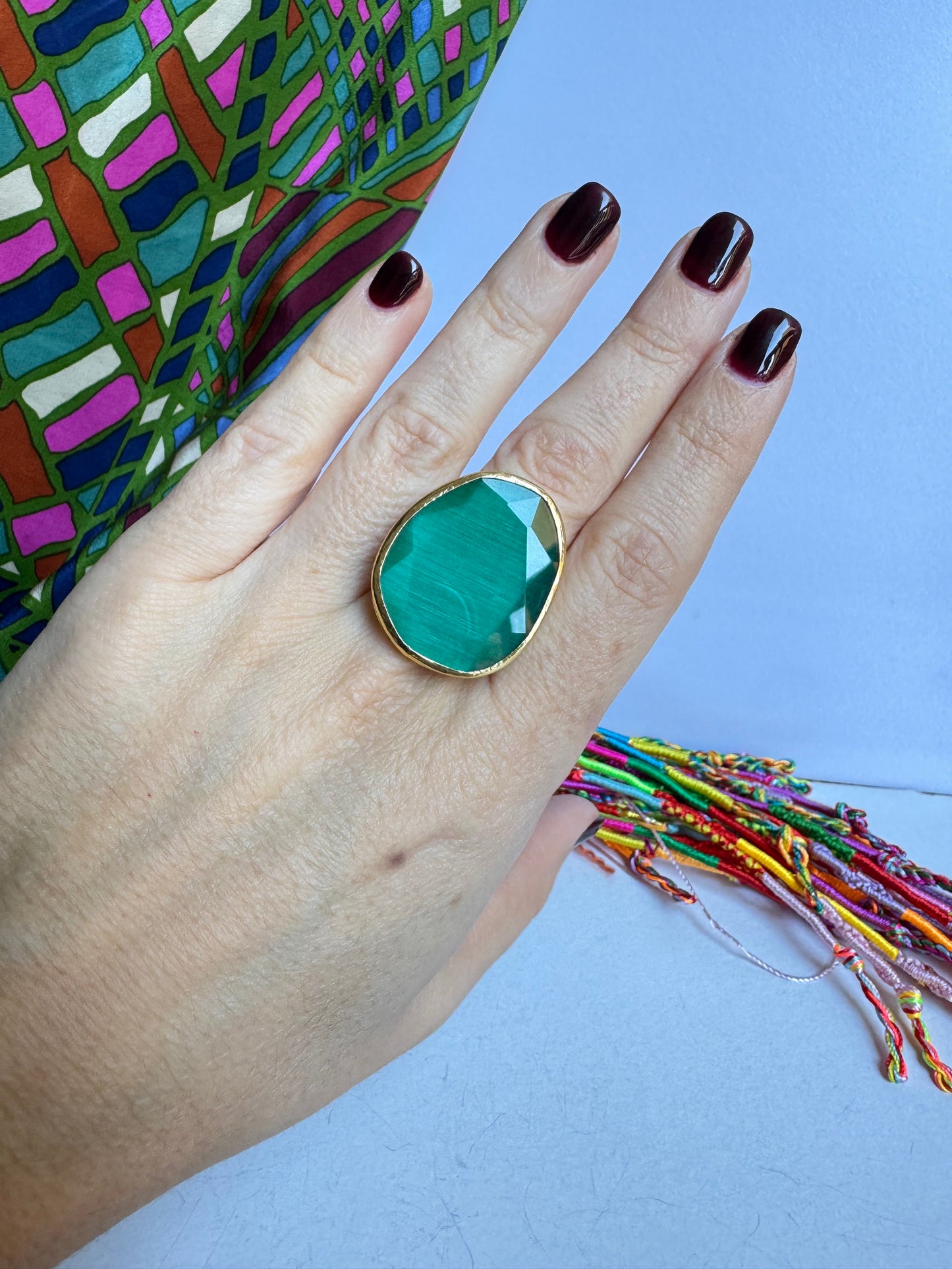 Golden ring drop green bottle