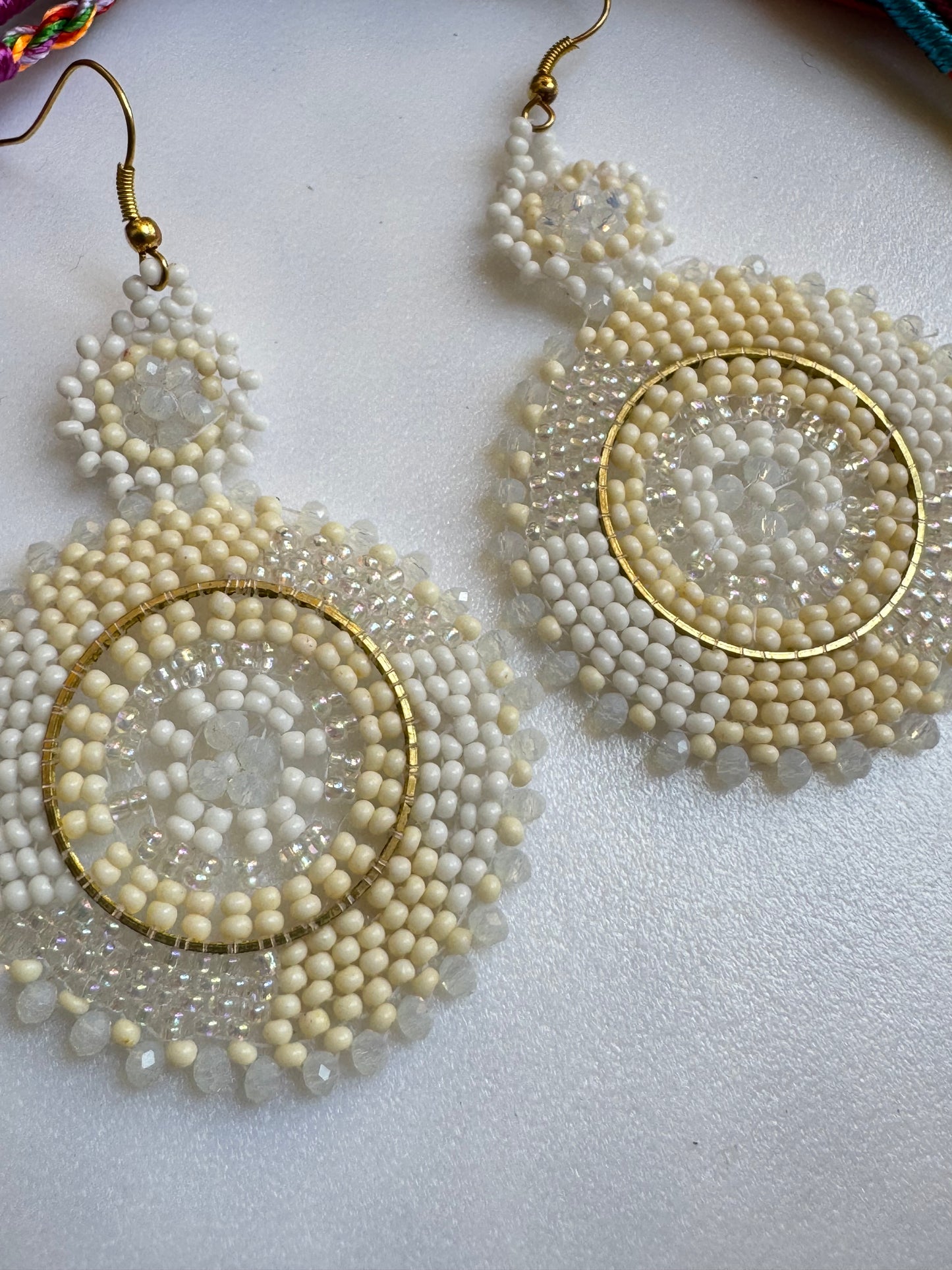 Golden earrings white beads