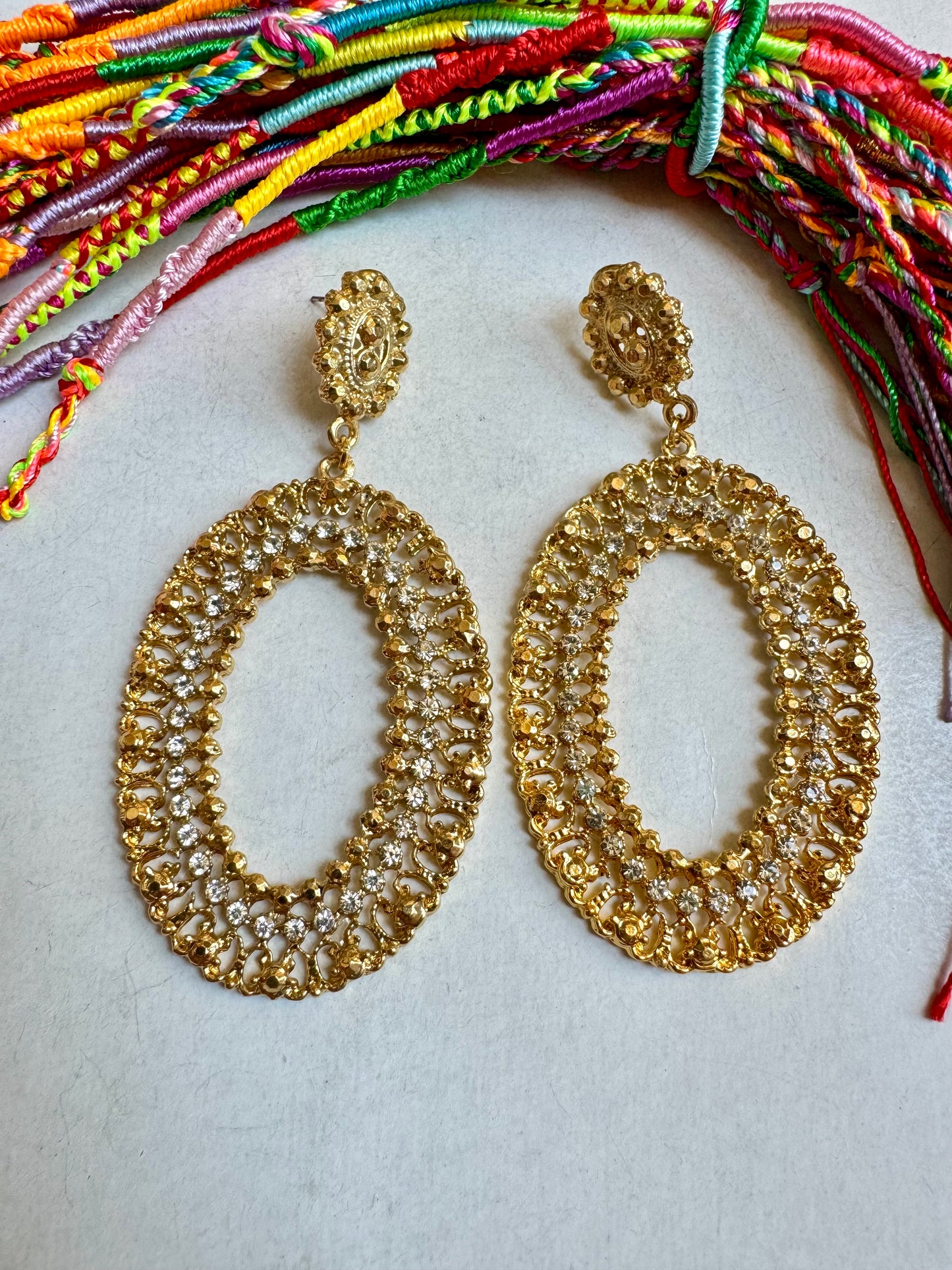 Golden oval glitter earrings