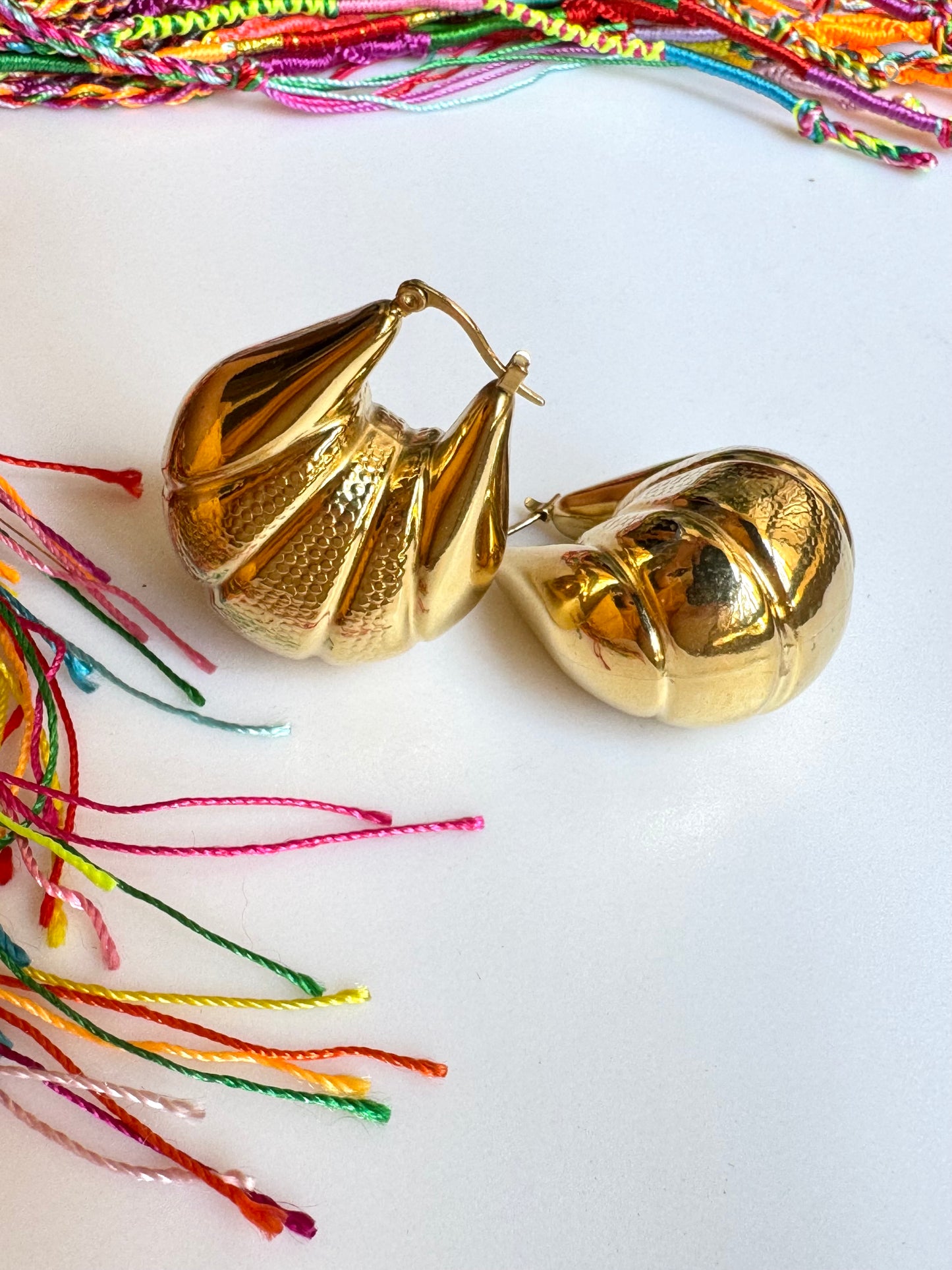 Domed gold steel earrings