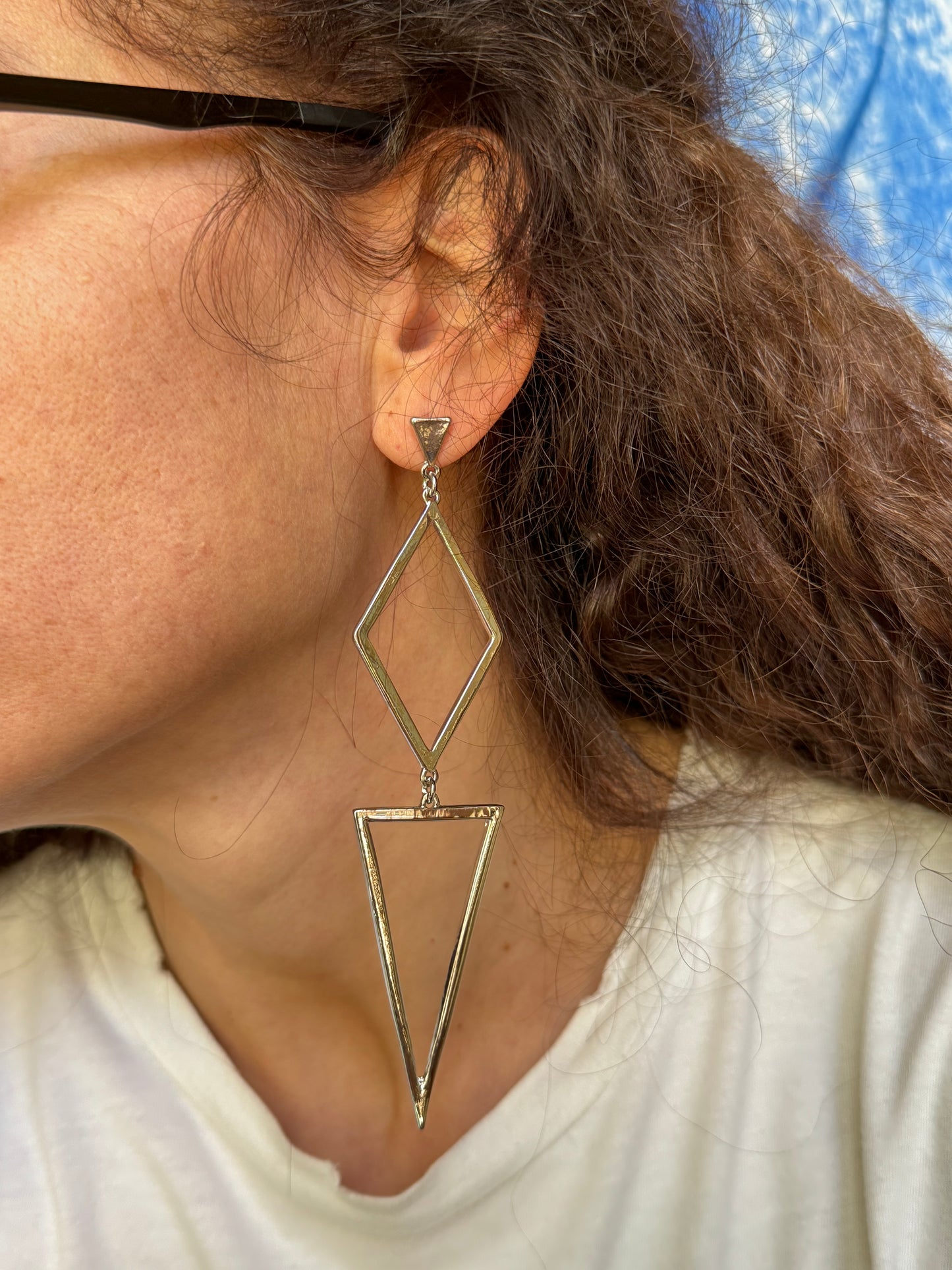 Silver pendant earrings of different lengths