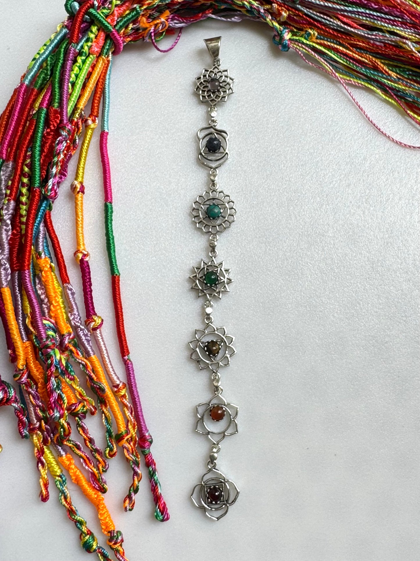 Silver necklace with seven chakra symbols and colors pendant