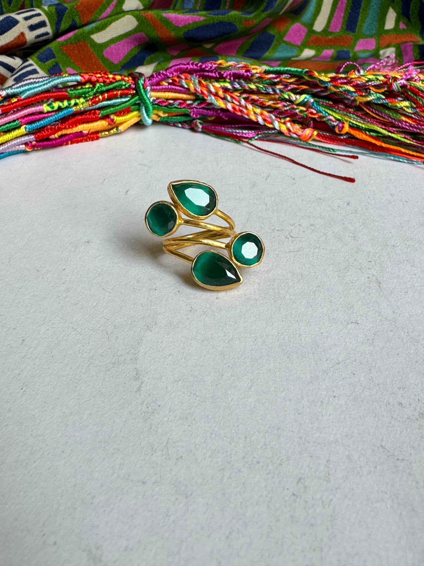 Golden ring with 4 green stones