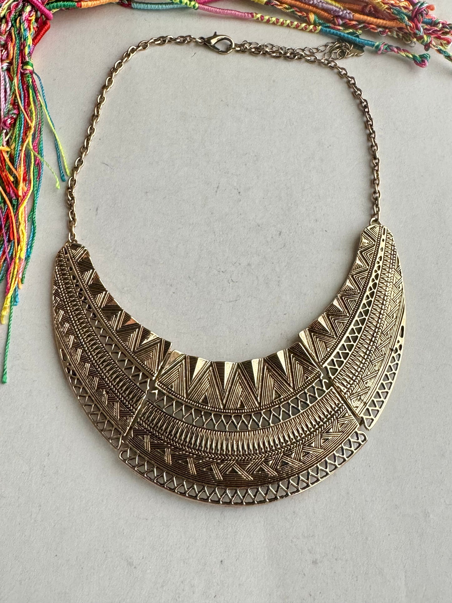 Golden engraved bib necklace