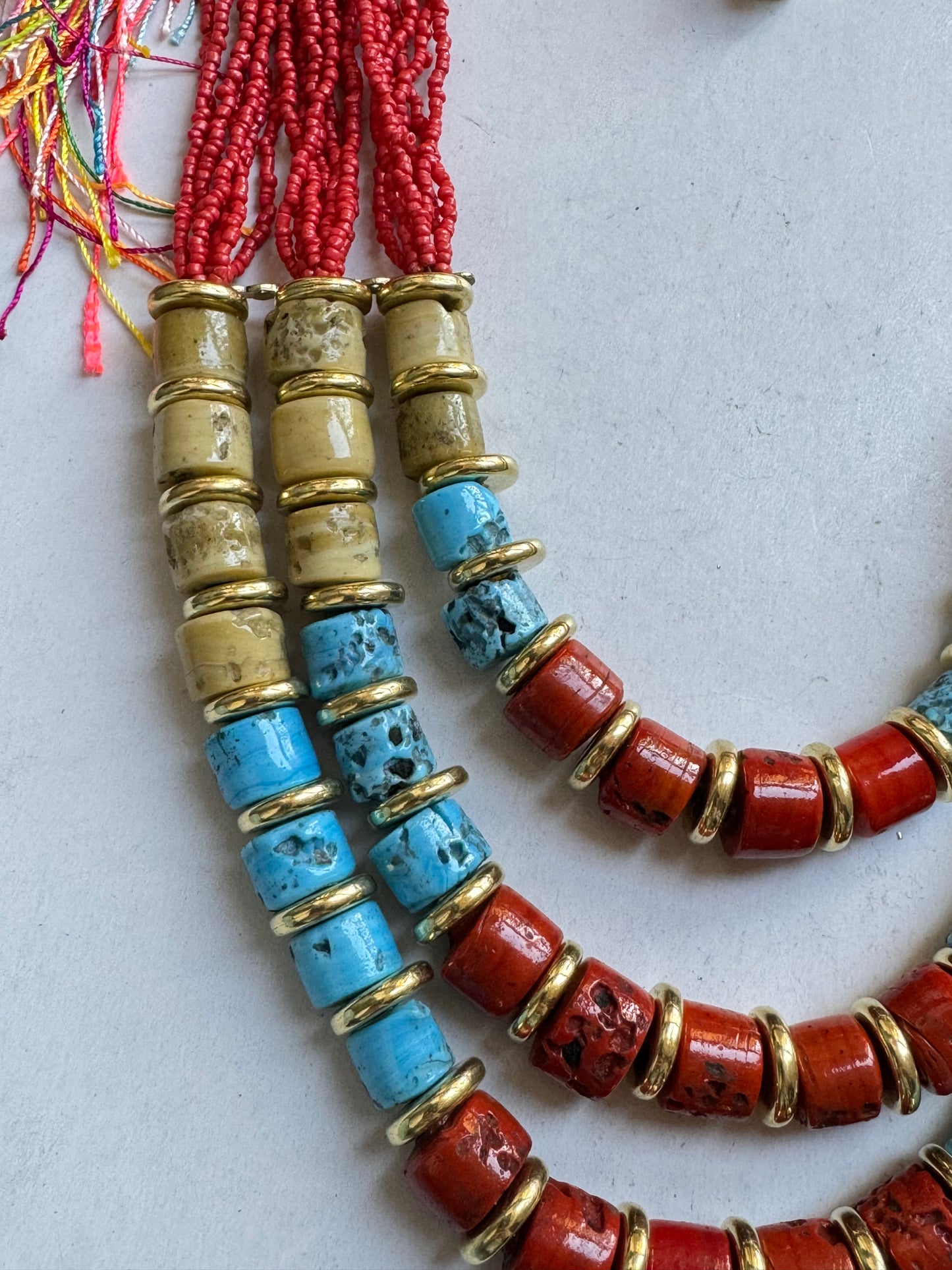 Multi-strand red beaded necklace