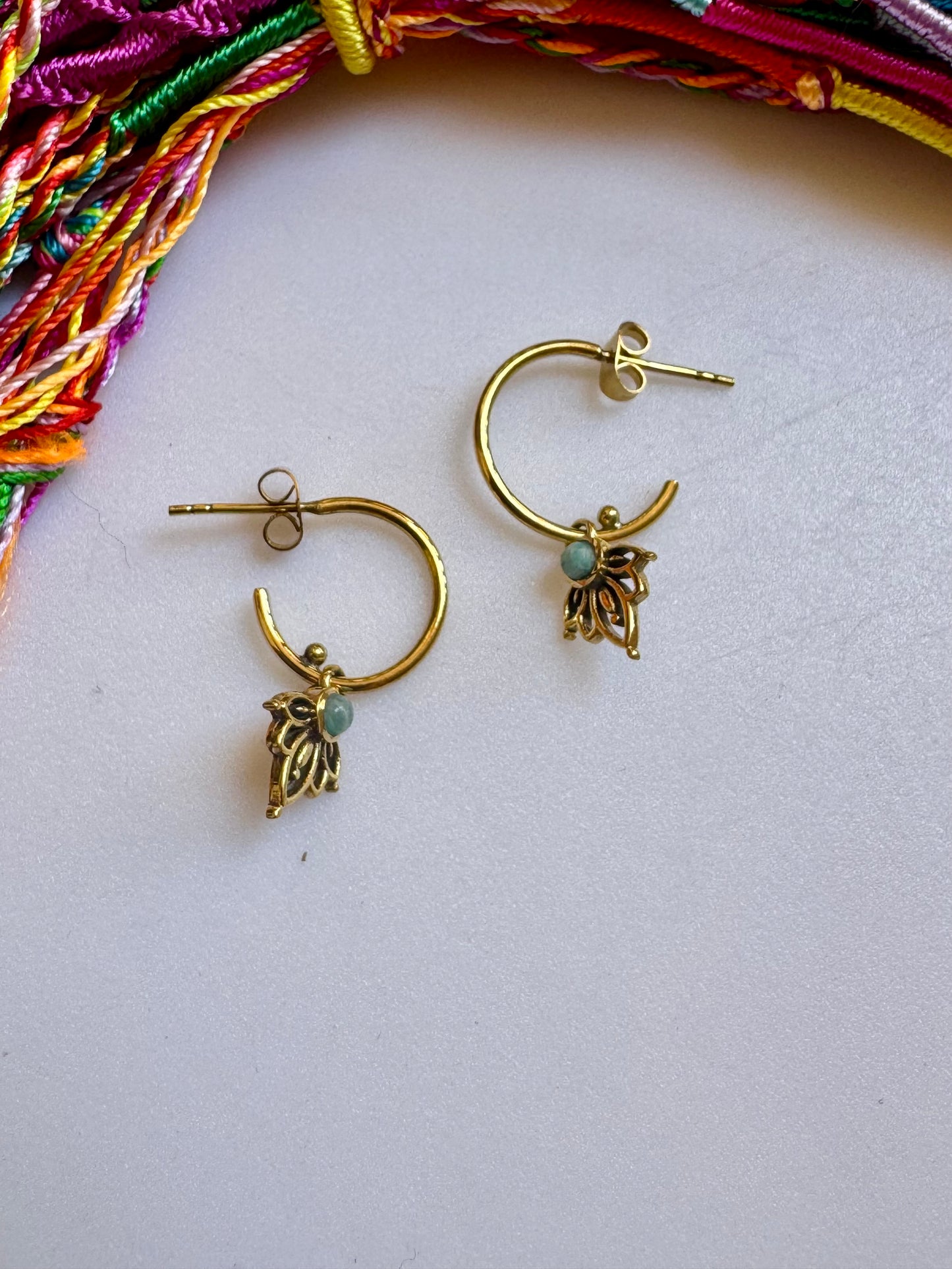 Golden boho earrings with a light blue hoop