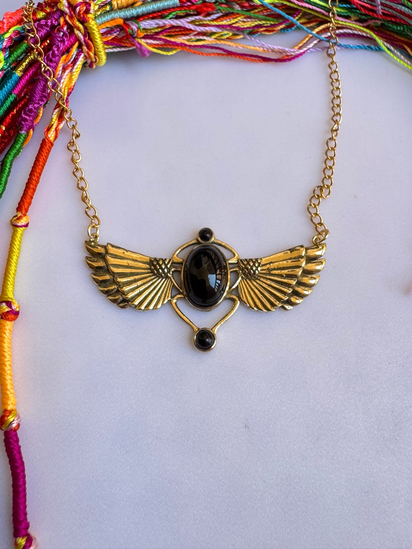 Golden necklace with black pendant