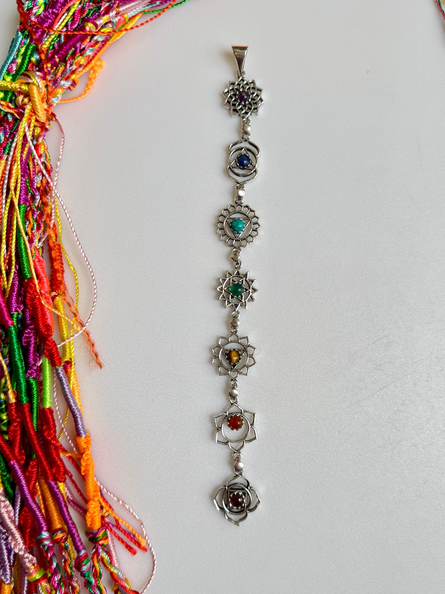 Silver necklace with seven chakra symbols and colors pendant
