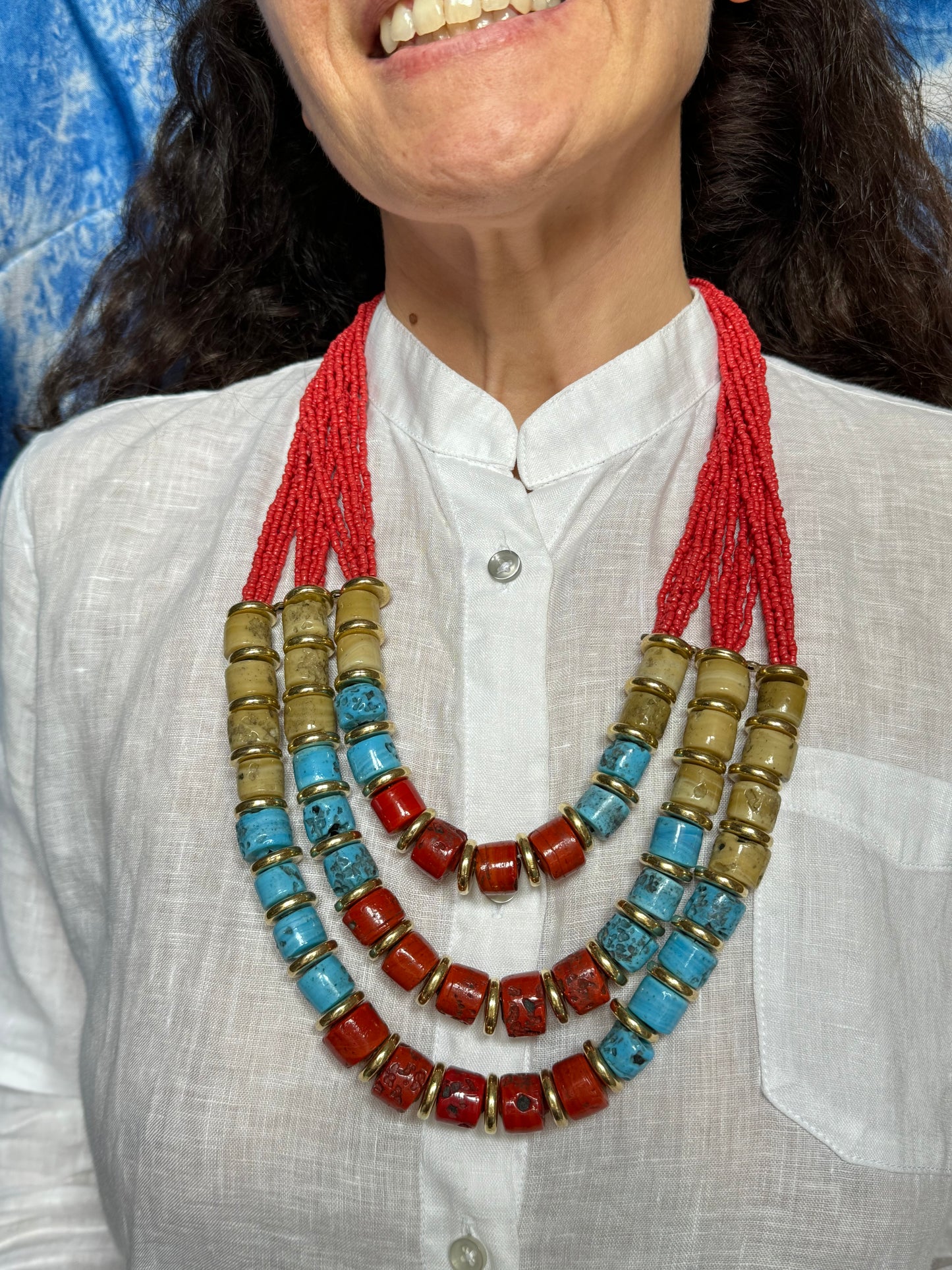 Multi-strand red beaded necklace