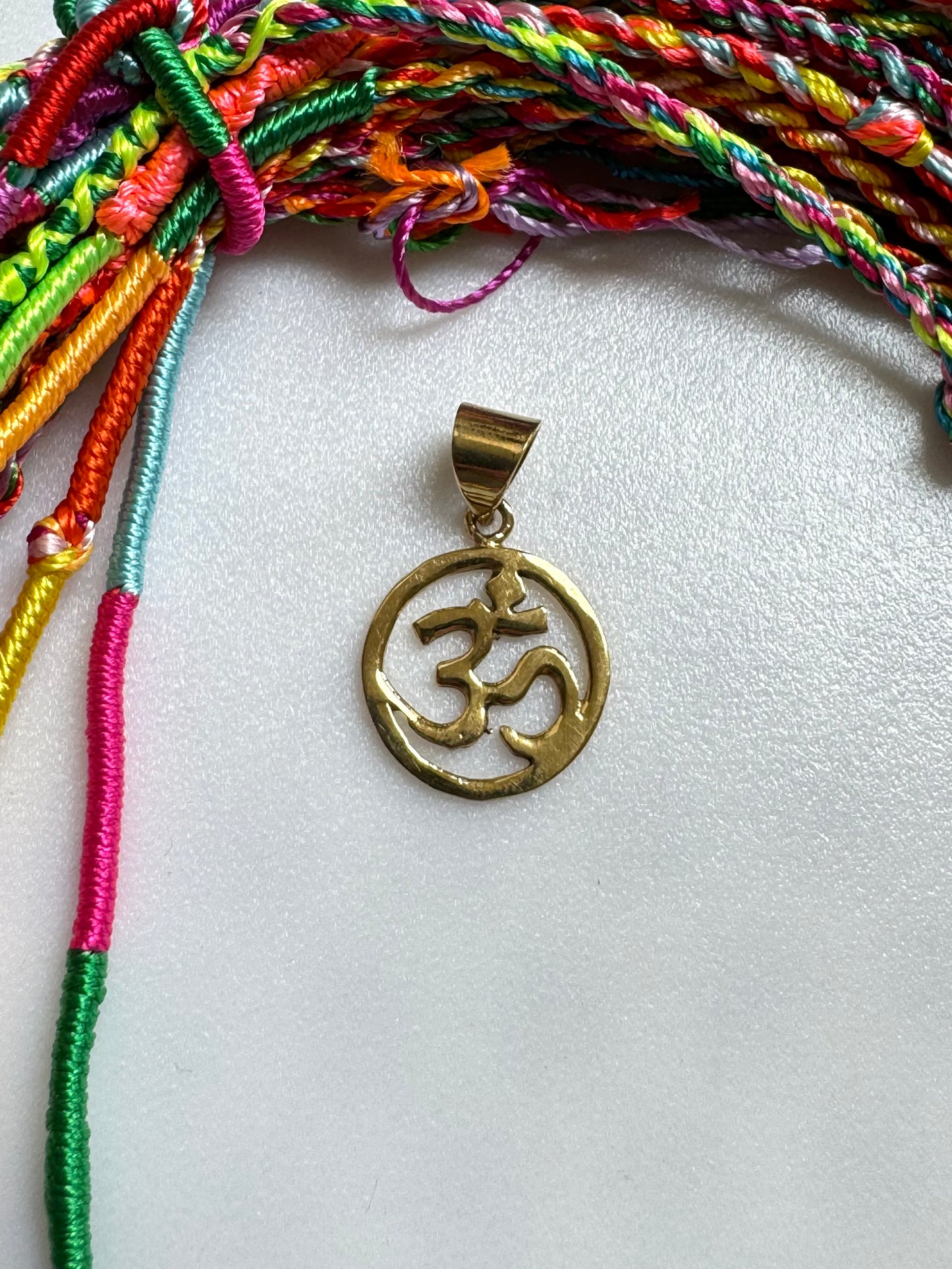 Golden necklace with ohm pendant