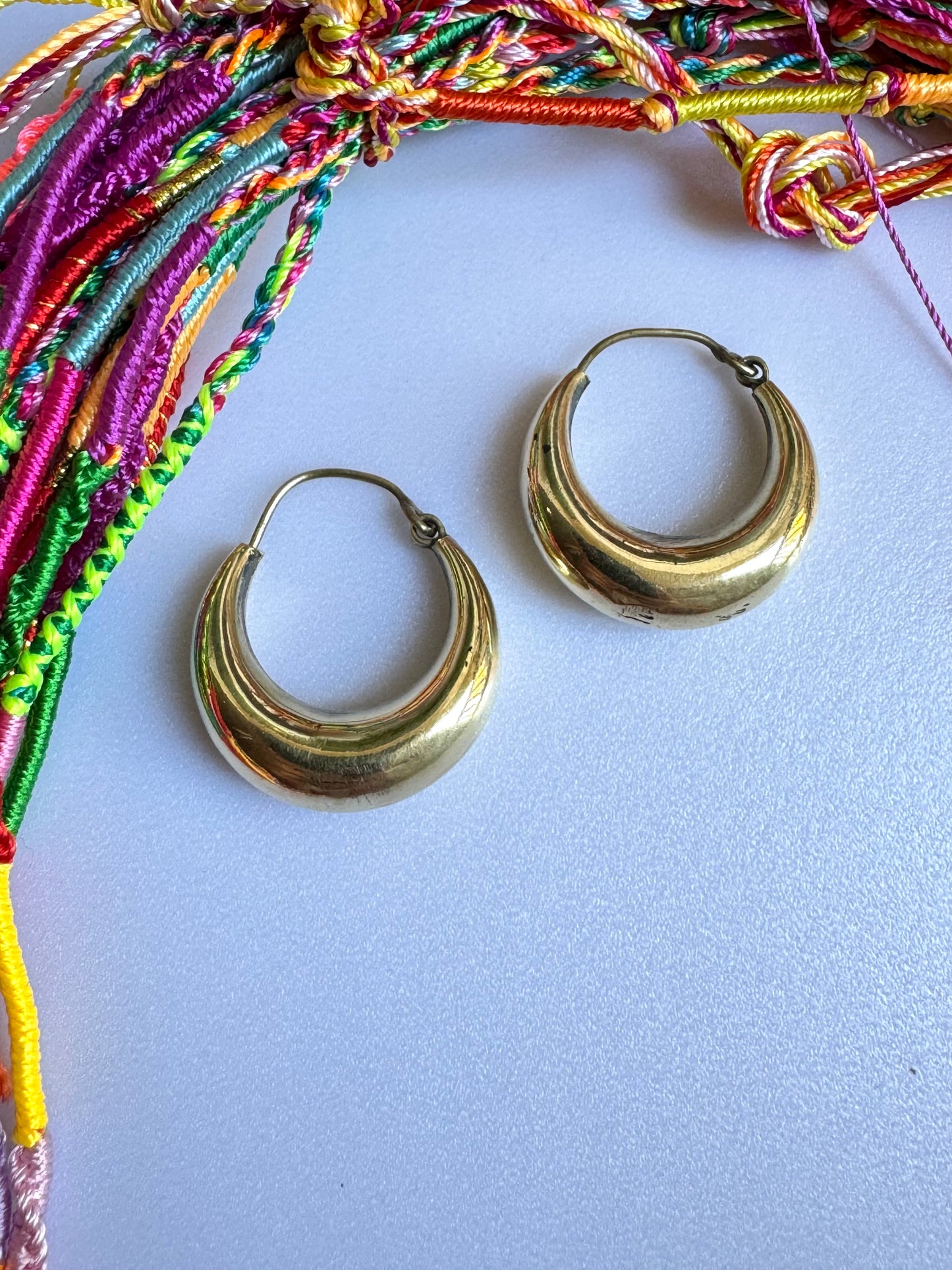 Large rounded golden boho earrings