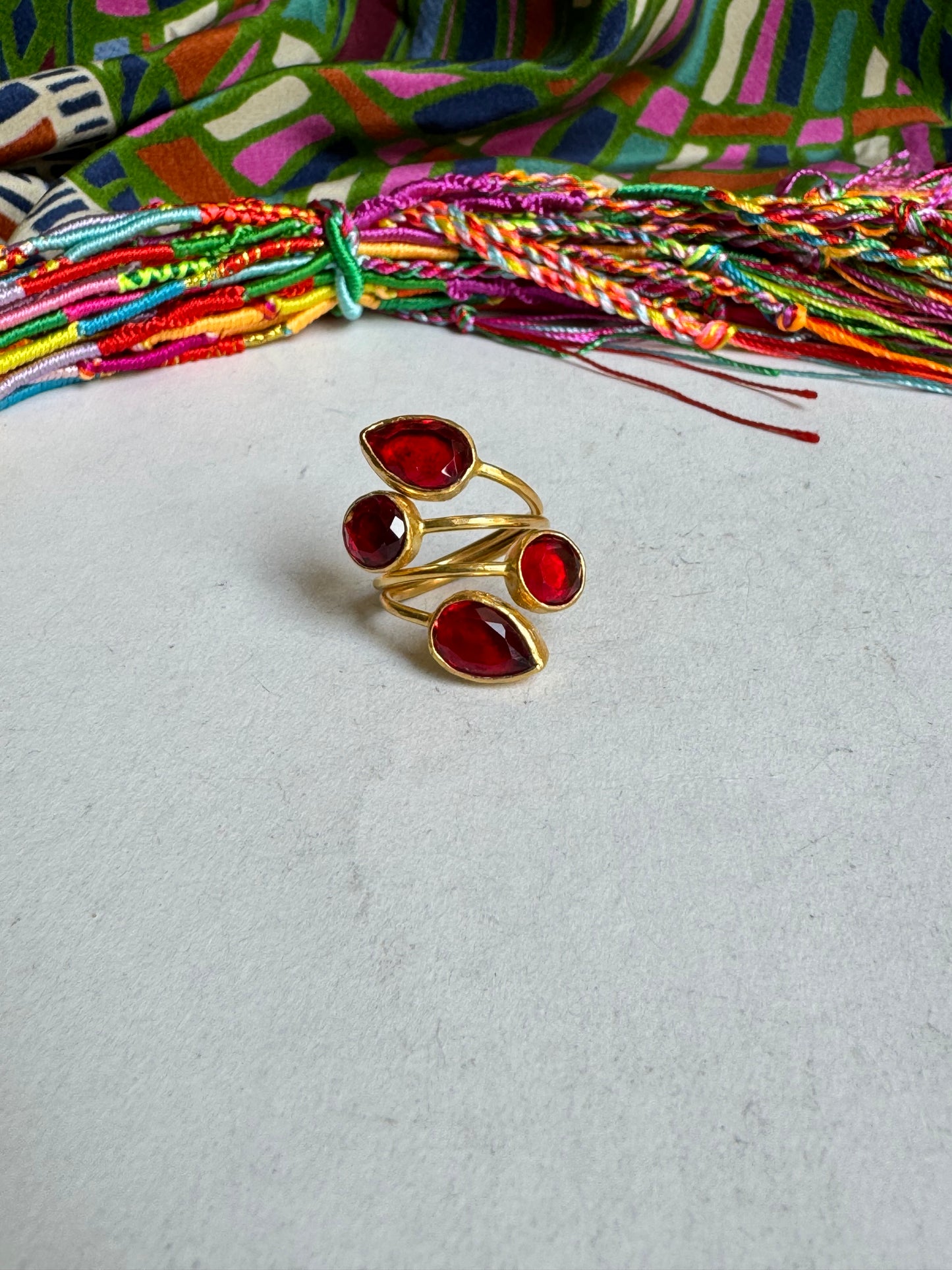 Golden ring with 4 red stones