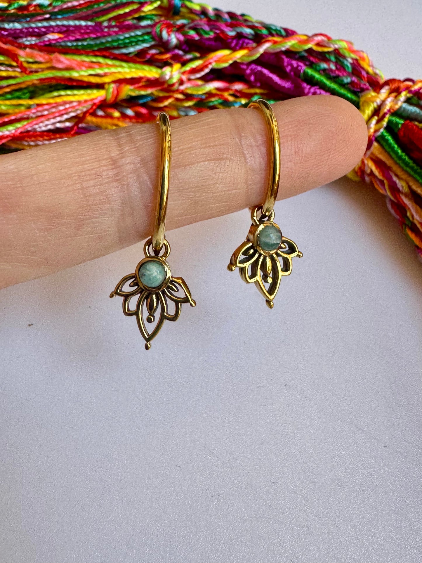 Golden boho earrings with a light blue hoop